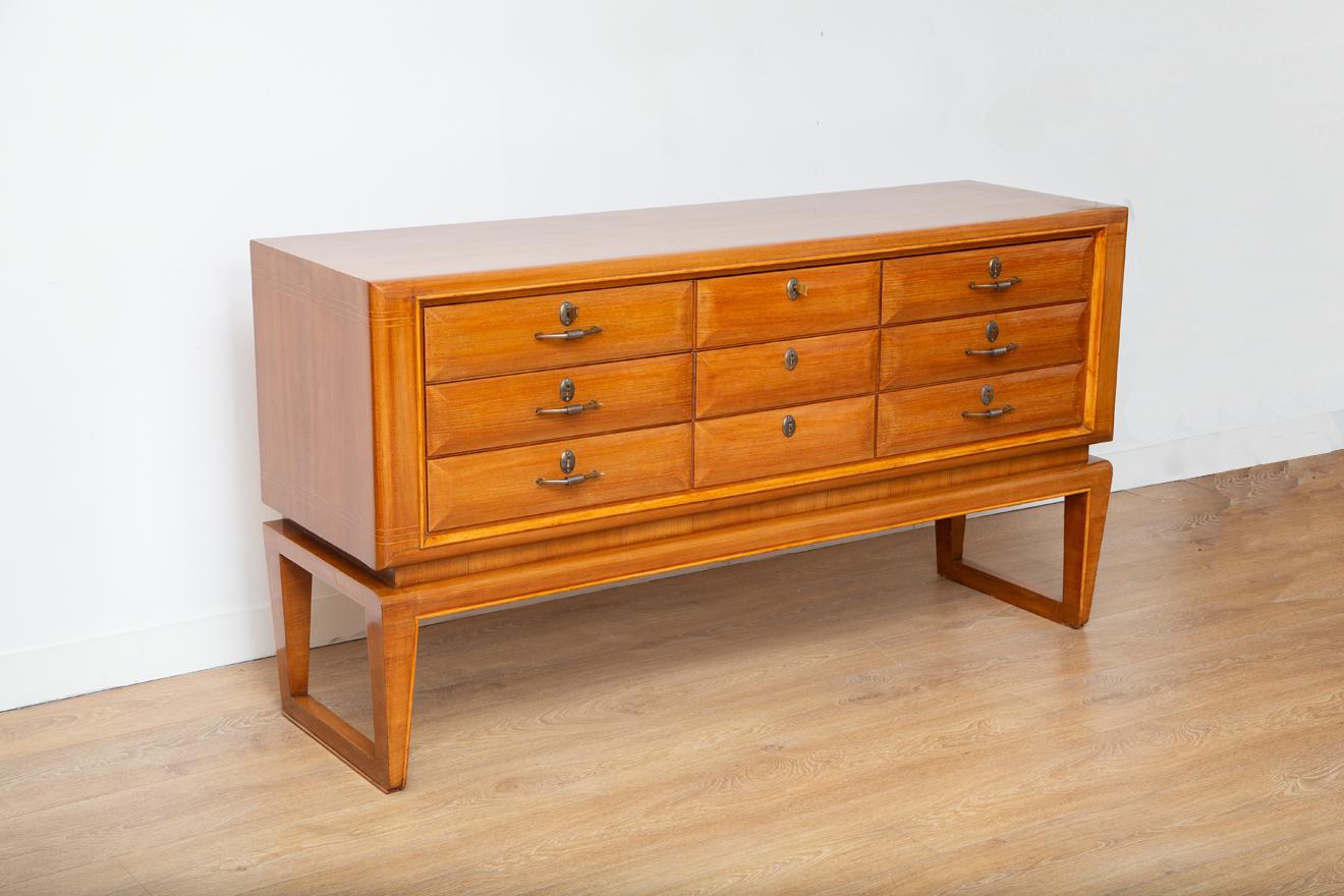 Mid-Century Modern Italian chest of drawers by Paolo Buffa
Six-drawer dresser, Italy circa 1940
Blonde walnut veneer with inlayed detailing, 
Floating loop legs and original ornate brass hardware.
Two original keys
Newly restored to almost