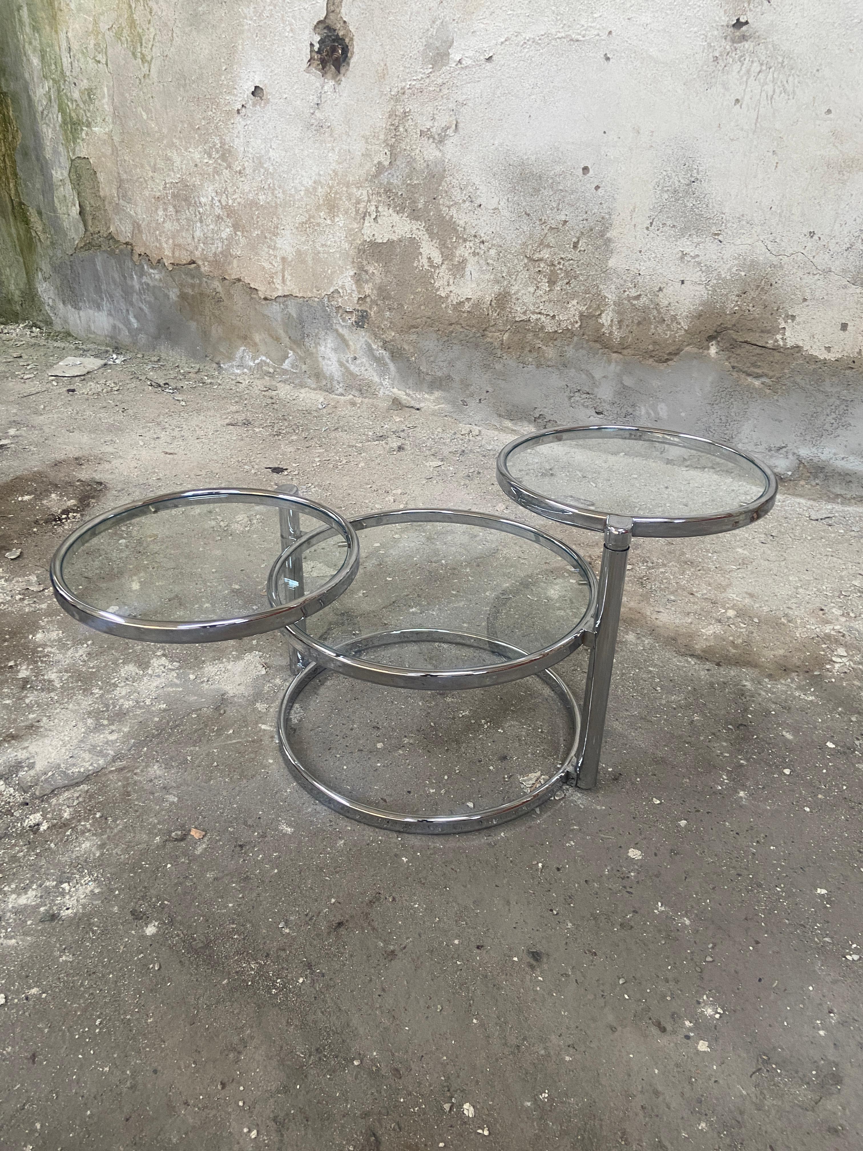 Mid-Century modern Italian Chrome and glass side or sofa table with rotating tops. 1970s
The table is in really good vintage conditions