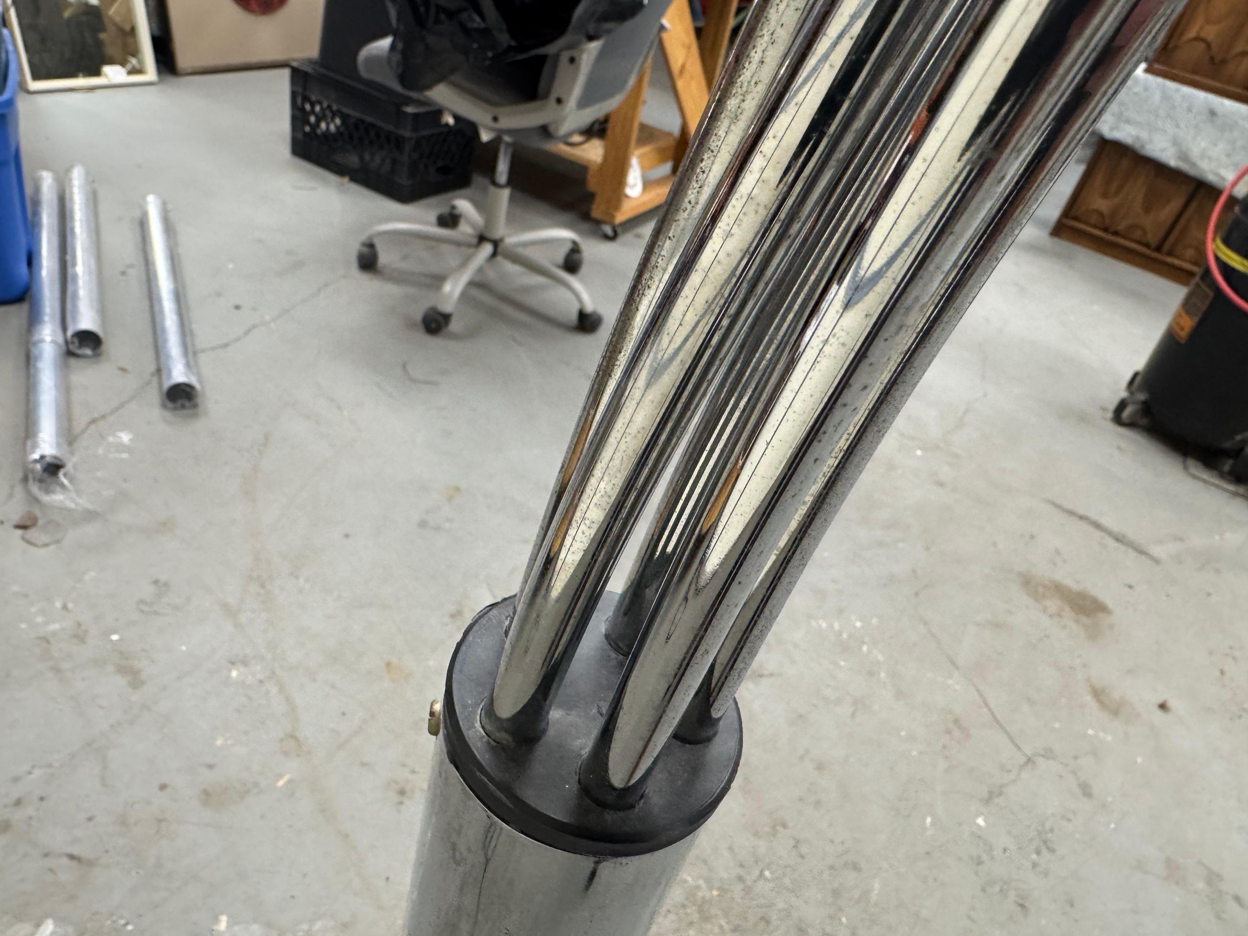 Offered is a super unique, vintage Italian chrome and marble floor lamp. Features a marble base with 5 arc-shaped chrome swiveling rods and 5 bulbs that pivot. The heads swivel from left to right and the pivot. The arms swivel, not all the way