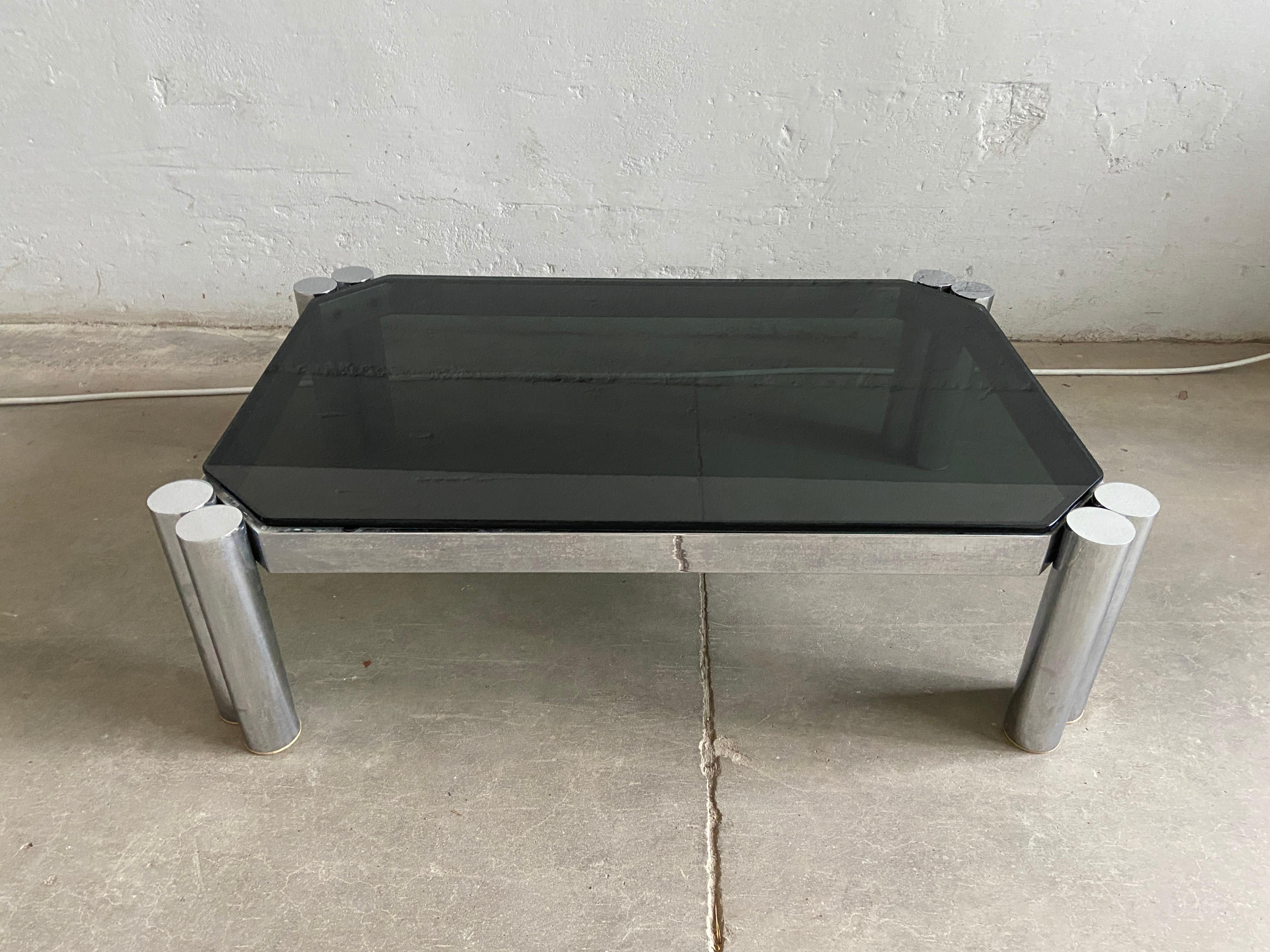 Mid-Century Modern Italian sofa or coffee table with smoked glass top and chrome legs. 1970s.