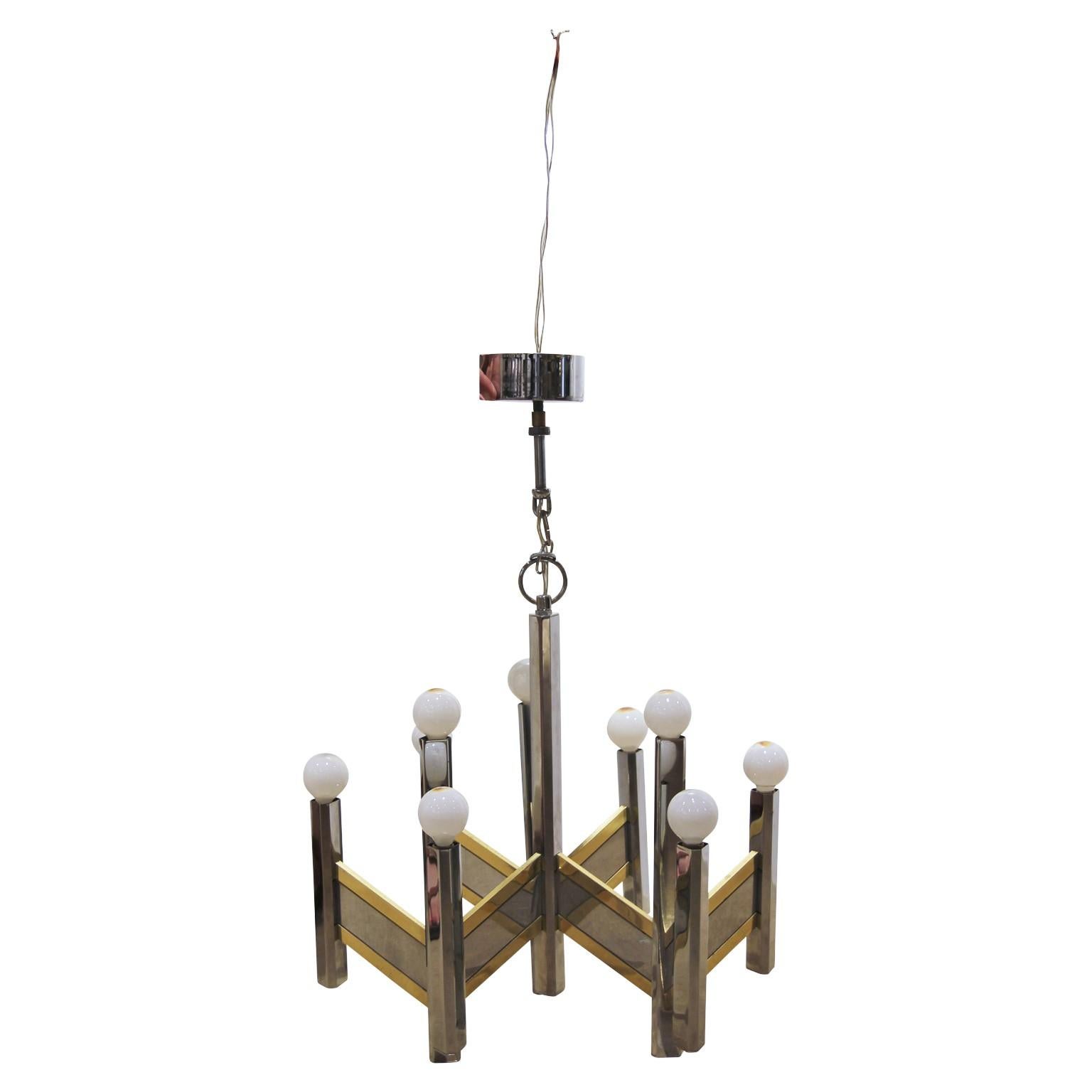 Italian modern chandelier designed by Gaetano Sciolari. The chandelier has fifteen points of lights. It is made of steel and brass. Gaetano Sciolari was an Italian designer known for his Mid-Century Modern lighting fixtures.
