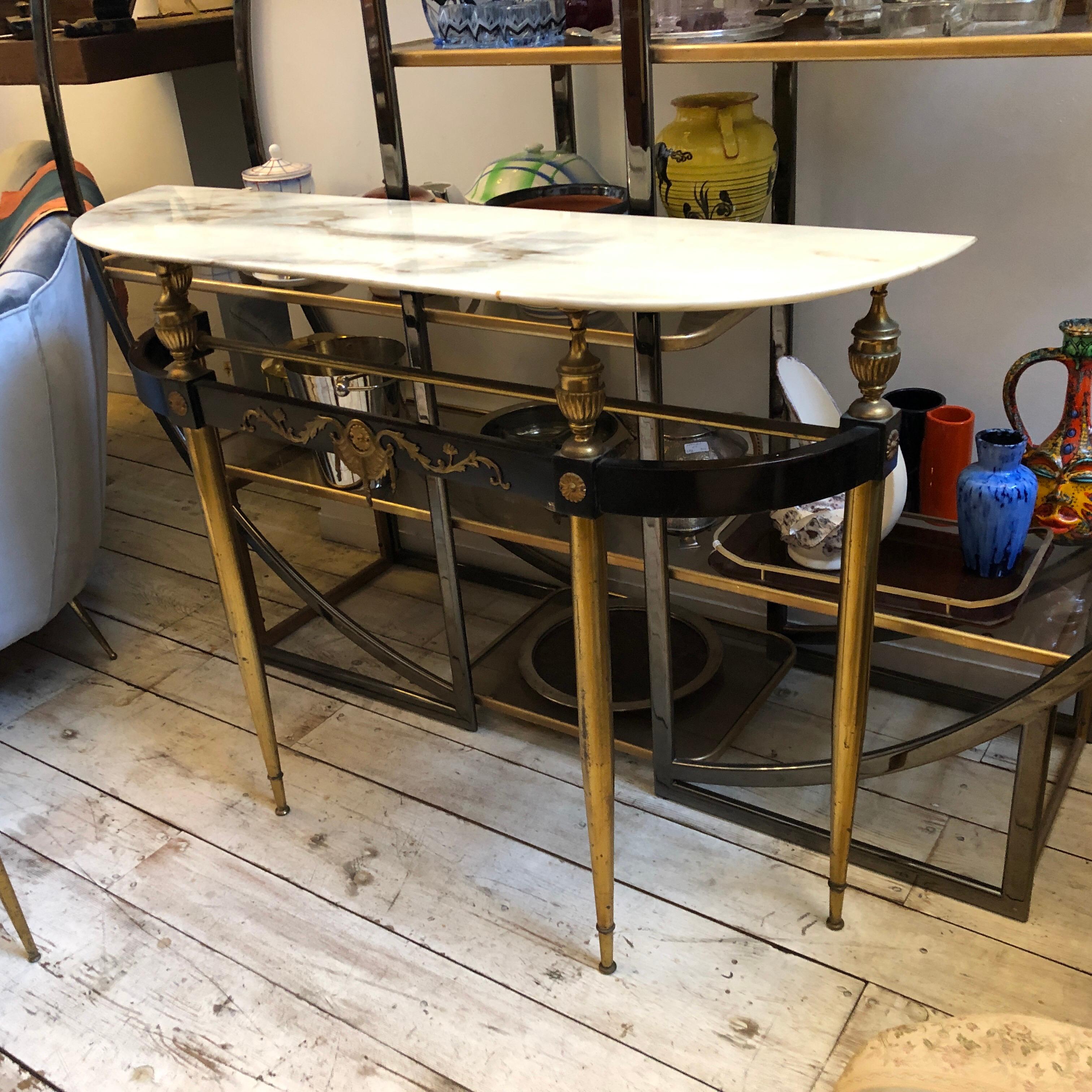 A mahogany, brass and iron console made in Italy in the 1960s, original Carrara marble top, good conditions overall.