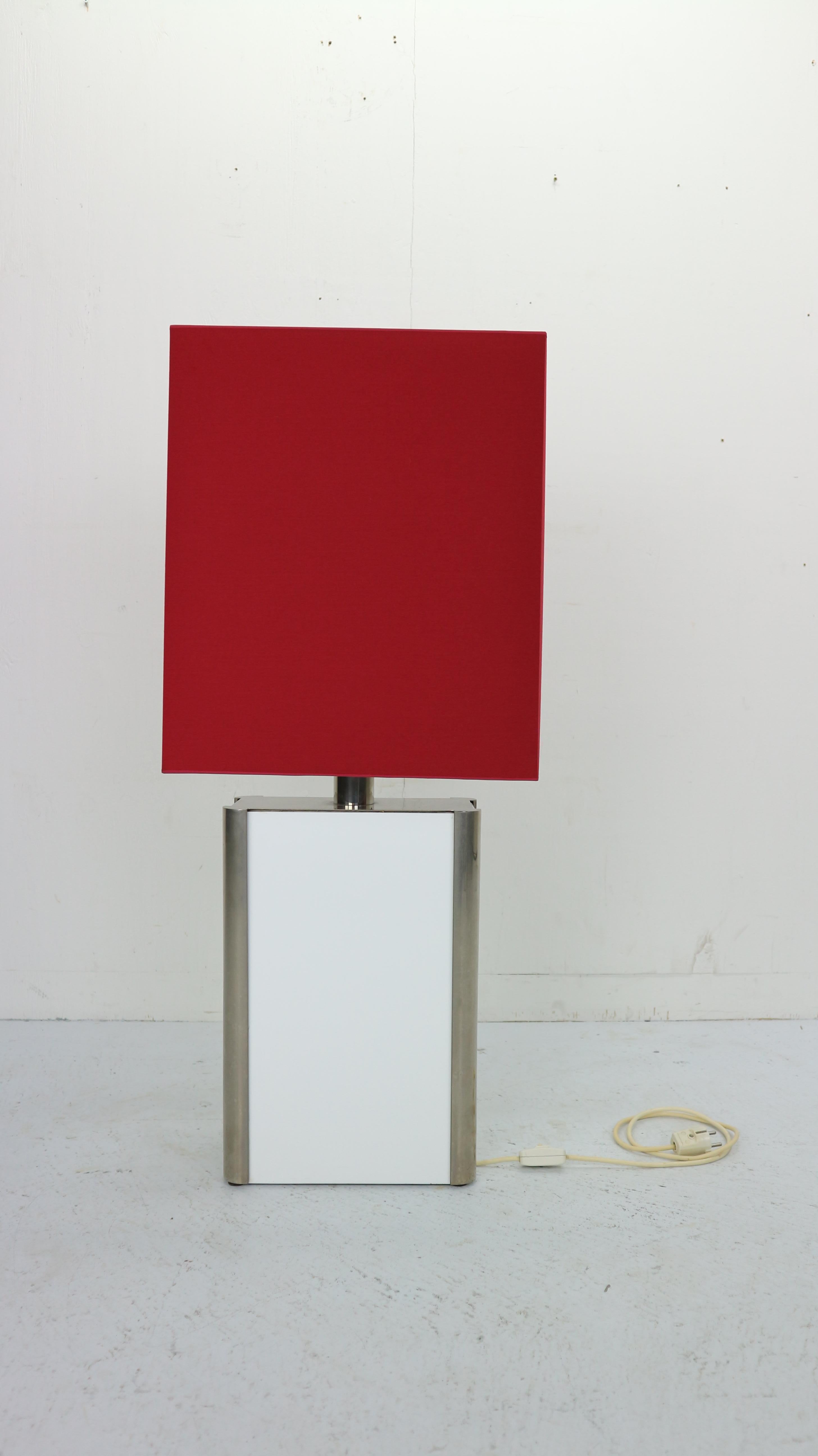 Vintage floor lamp made in 1970s Italy. Modern Italian design floor lamp is a beautiful accent for your design home.
The lamp consists metal frame with acrylic white base and red color newly upholstered lamp shade.
   