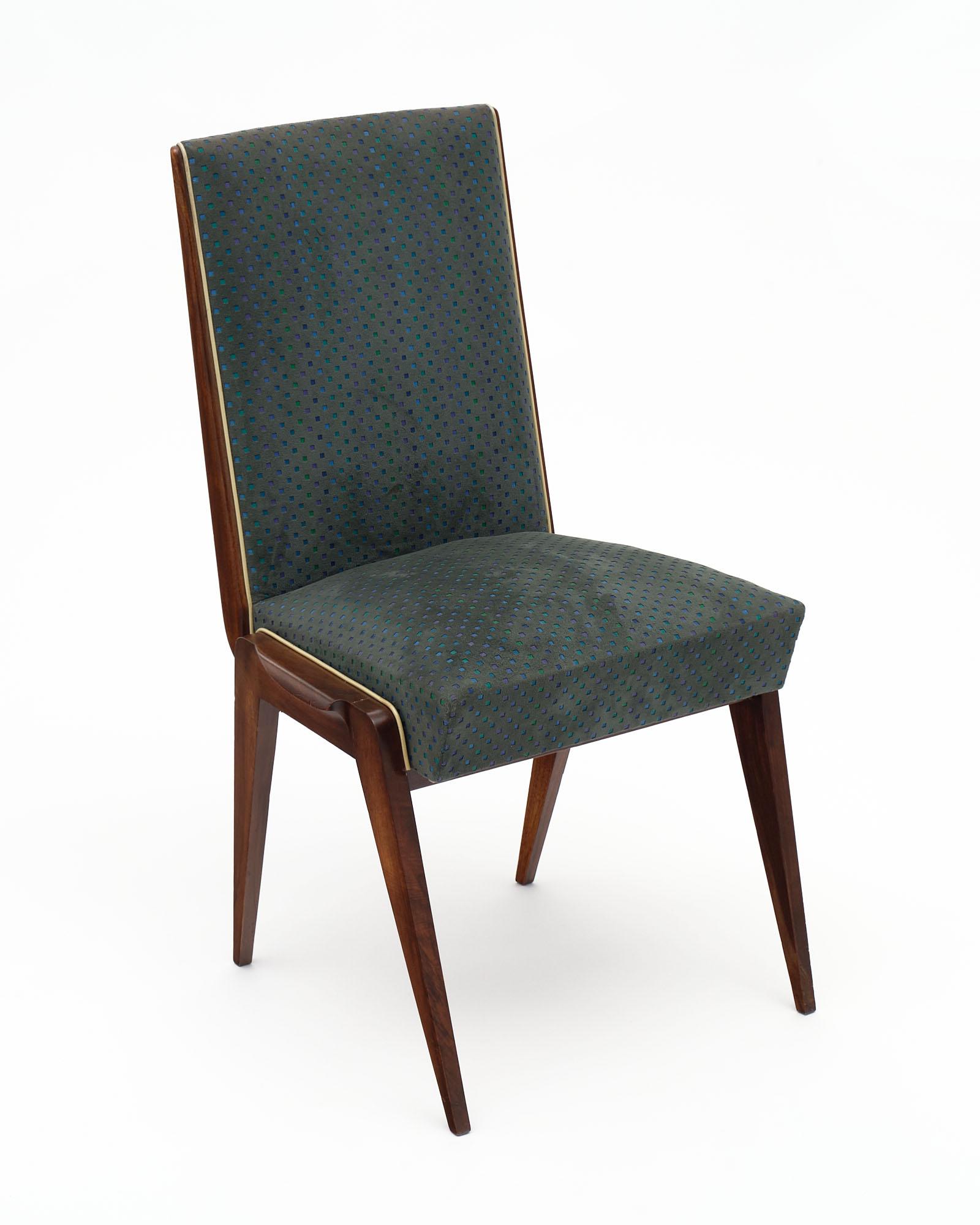 Set of six Italian Mid-Century Modern dinning room chairs. The frame of each chair is made of a strong solid walnut structure with tapered legs. These feature original turquoise and green velvet blend upholstery.
