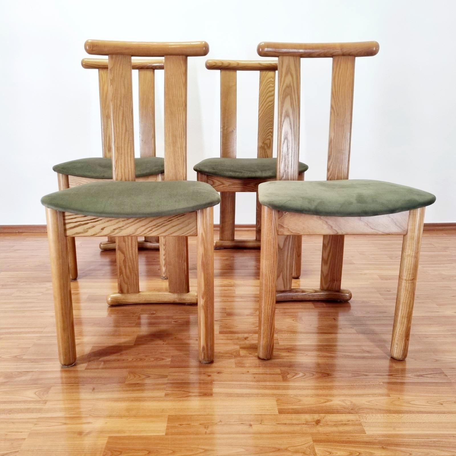 Set of 4 rare Italian dinning chairs. Made in the late 80s.
They are in good vintage condition, with traces of use on the wood. The seating areas were recently reupholsted.