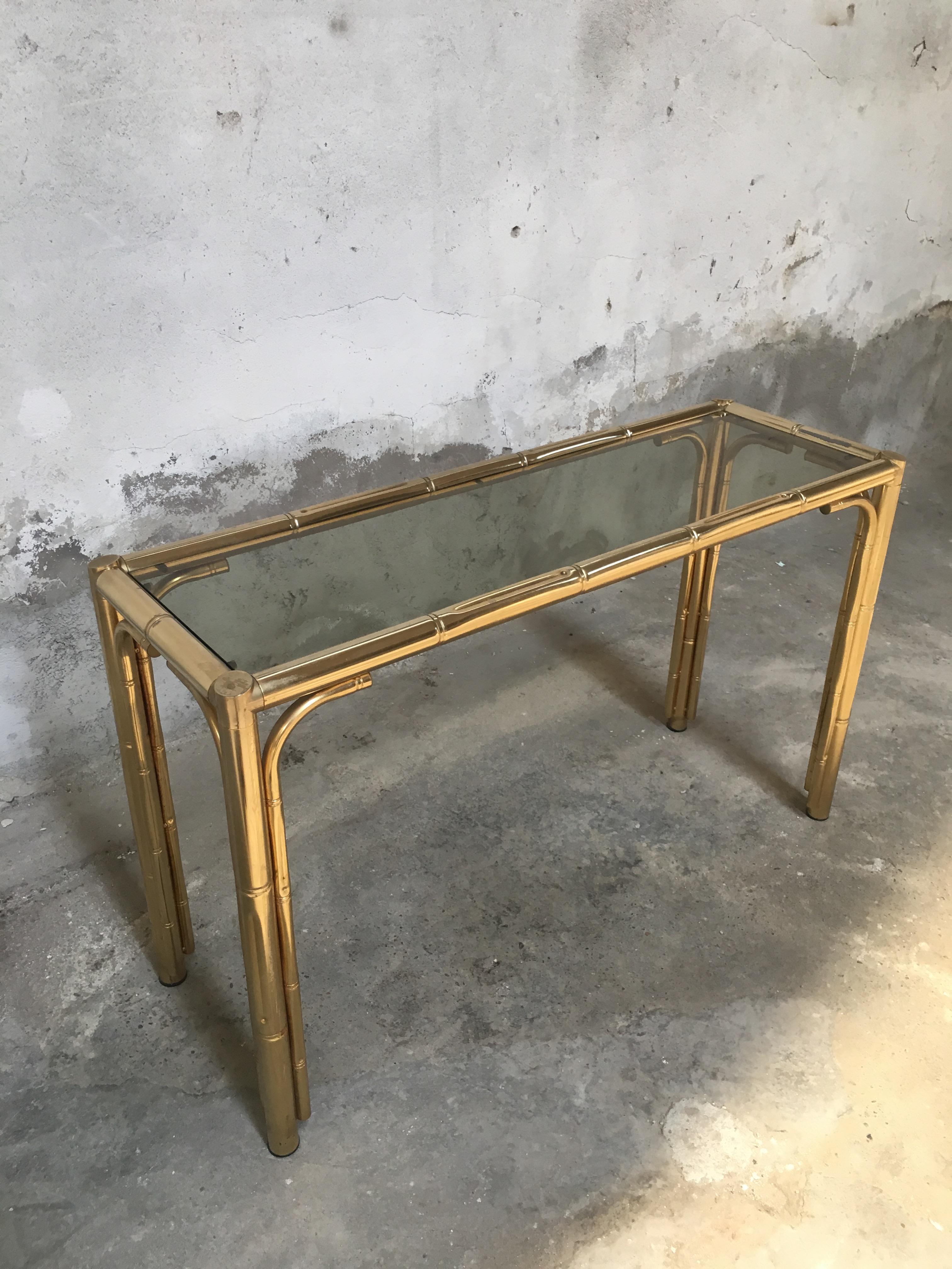 Mid-Century Modern Italian faux bamboo brass finished console with smocked glass top. 1970s.