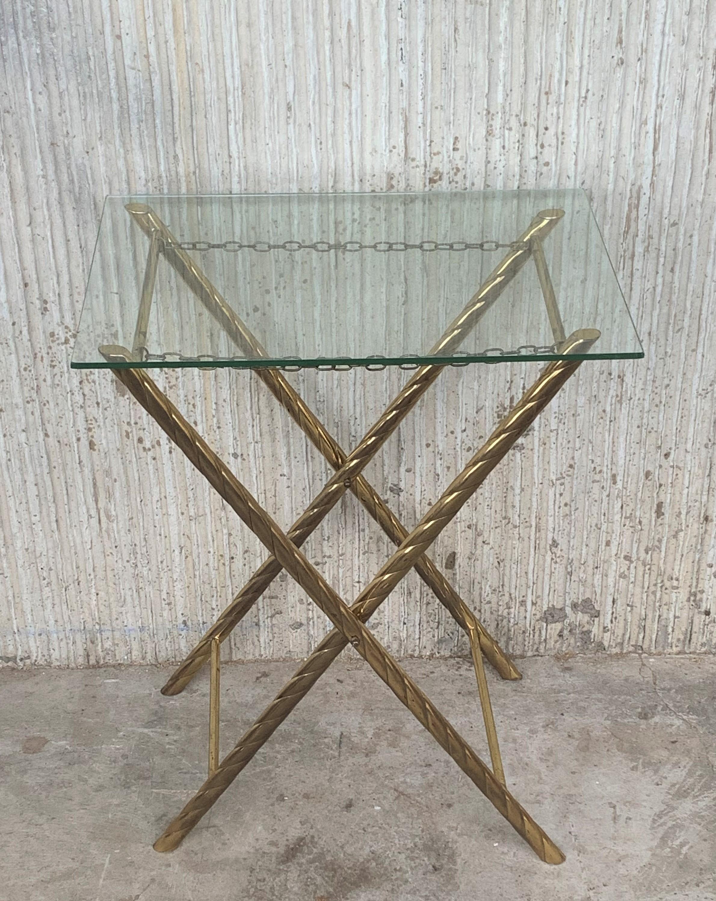 Folding coffee table and stand in faux brass bamboo manufactured in the 1960s.
This fantastic table is like we have never seen before.