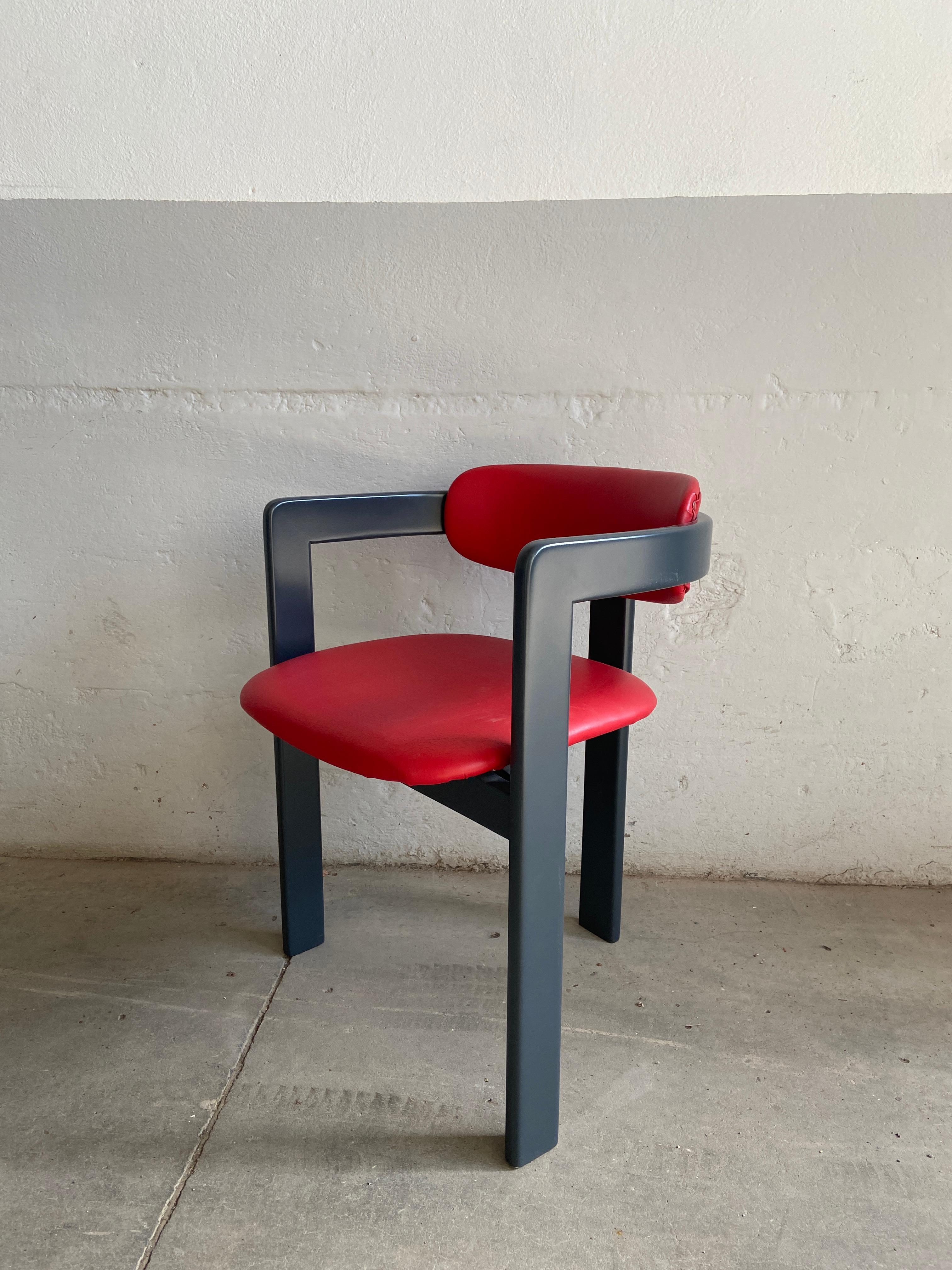 Mid-Century Modern Italian faux leather chair in the style of Augusto Savini with dark grey lacquered wood structure. 1980s
The chair has never been used and it is in perfect vintage conditions.