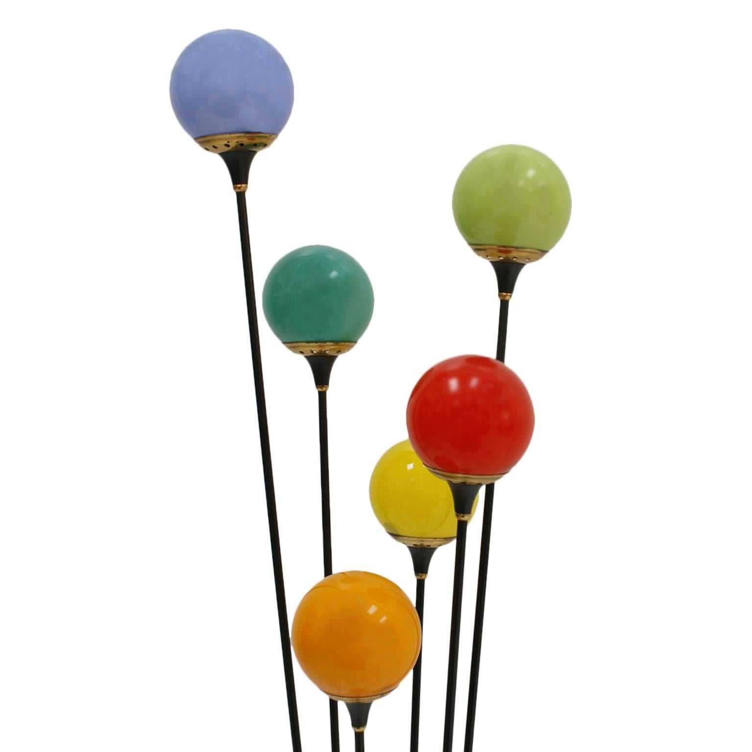 Floor lamp designed by Stilnovo, composed of six light points. Structure made of black lacquered iron with brass finishes, coloured matt sphere glass shades (in 6 different colours) and white round marble base with switch. Italy, 1950s.