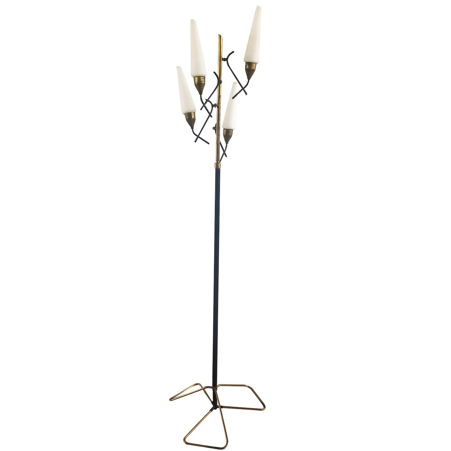 A black vintage Mid-Century Modern Italian floor lamp, light made of iron and brass. The opal glass shades are halted by four spiral arms. Produced by Stilnovo, each shade is featuring a one light socket in good condition. Model 336. The wires have