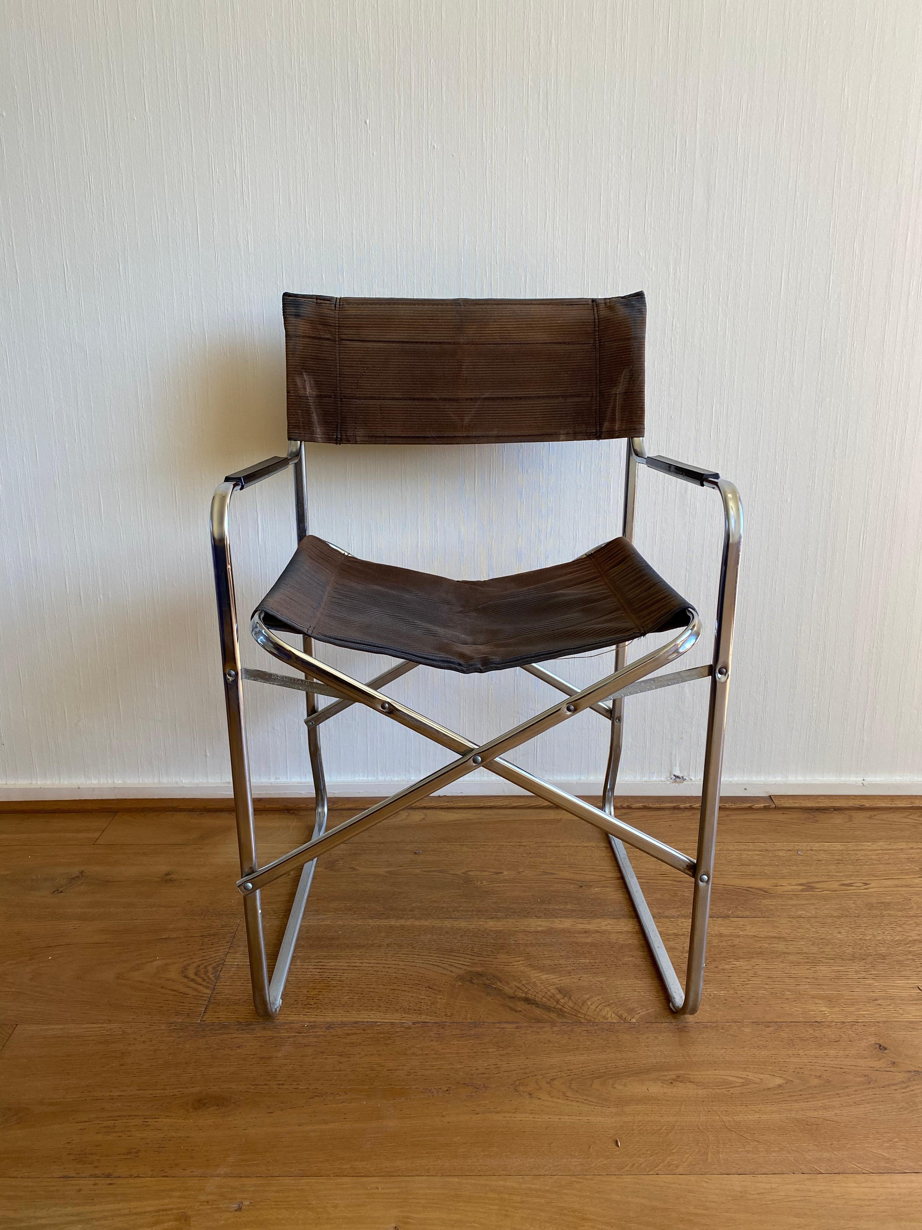 Stunning folding chair with metal frame and original Brown Coduroy fabric. The chair's design is Similar to Gae Aulenti's April Chair for Zanotta and was Manufactured in Italy. The chair is very light and easy to store while it can be folded. It