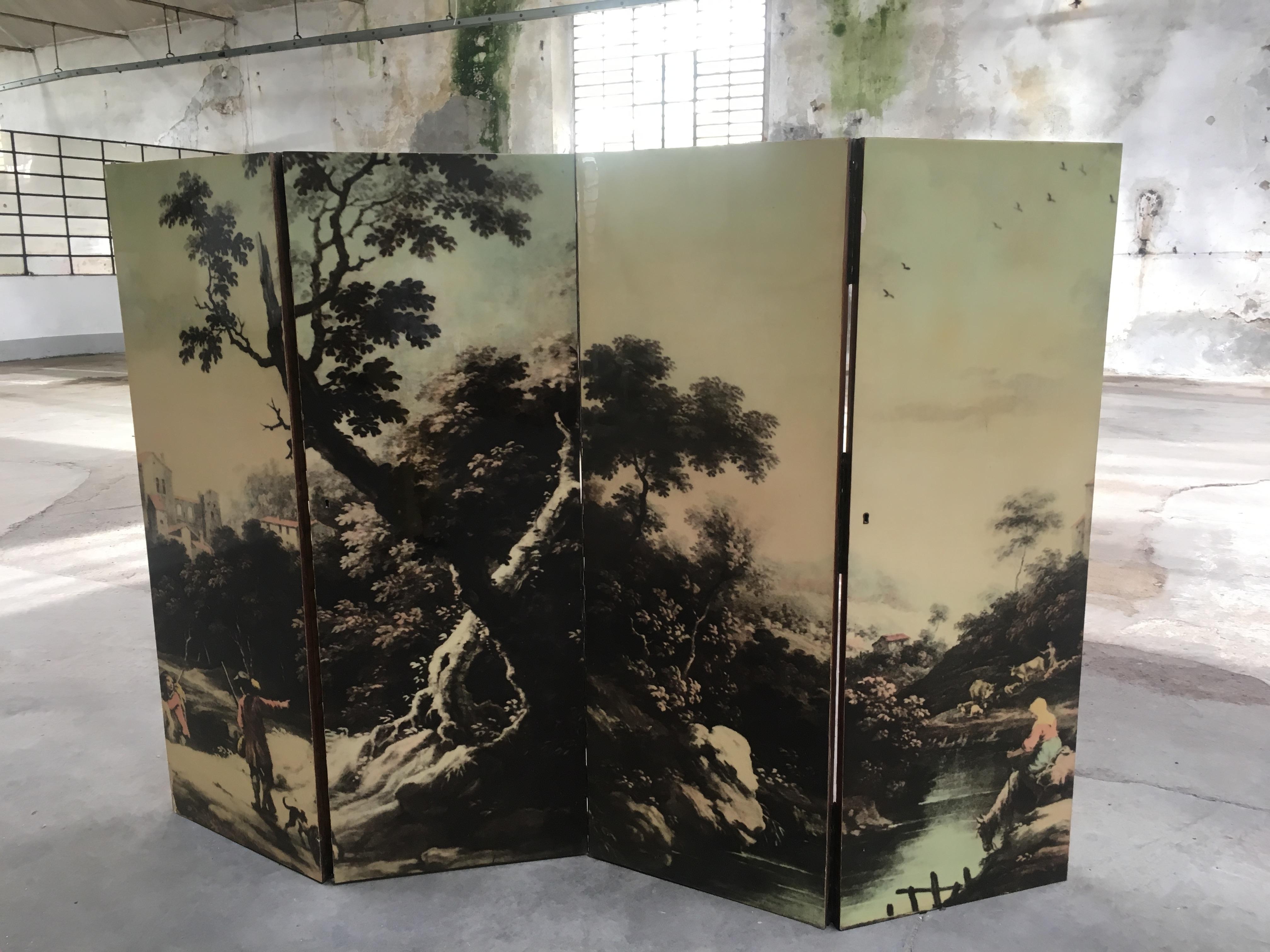 Mid-Century Modern Italian folding four-panel screen with bucolic transfer painting. 1960s
Each panel measures cm.53 x 3 x H 148.
 