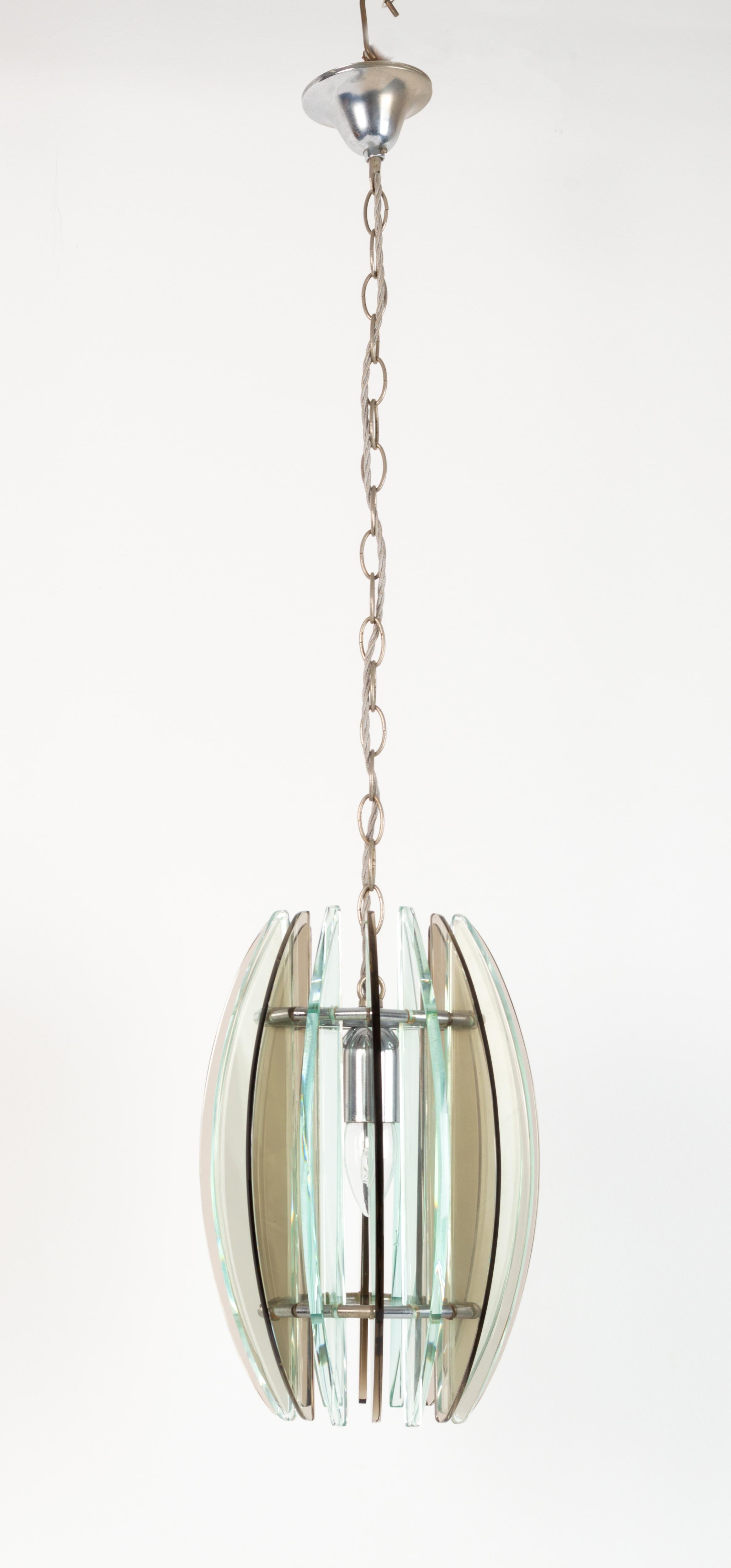 Mid-Century Modern Italian glass and nickel pendant light.
In the manner of Max Ingrand for Fontana Arte.
Thick green and smoked glass with a single central light source.

Excellent condition commensurate of age. Free from chips.
  