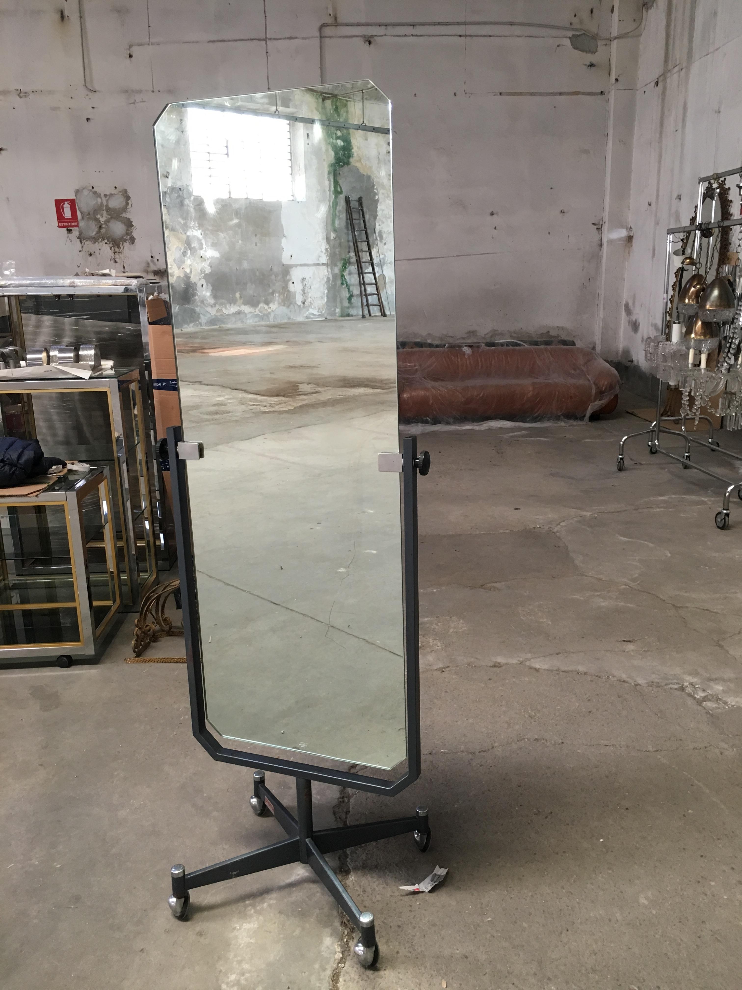 Mid-Century Modern Italian full length freestanding Psyche mirror on wheels with black lacquered metal structure. 
The mirror is in very good vintage conditions.
 