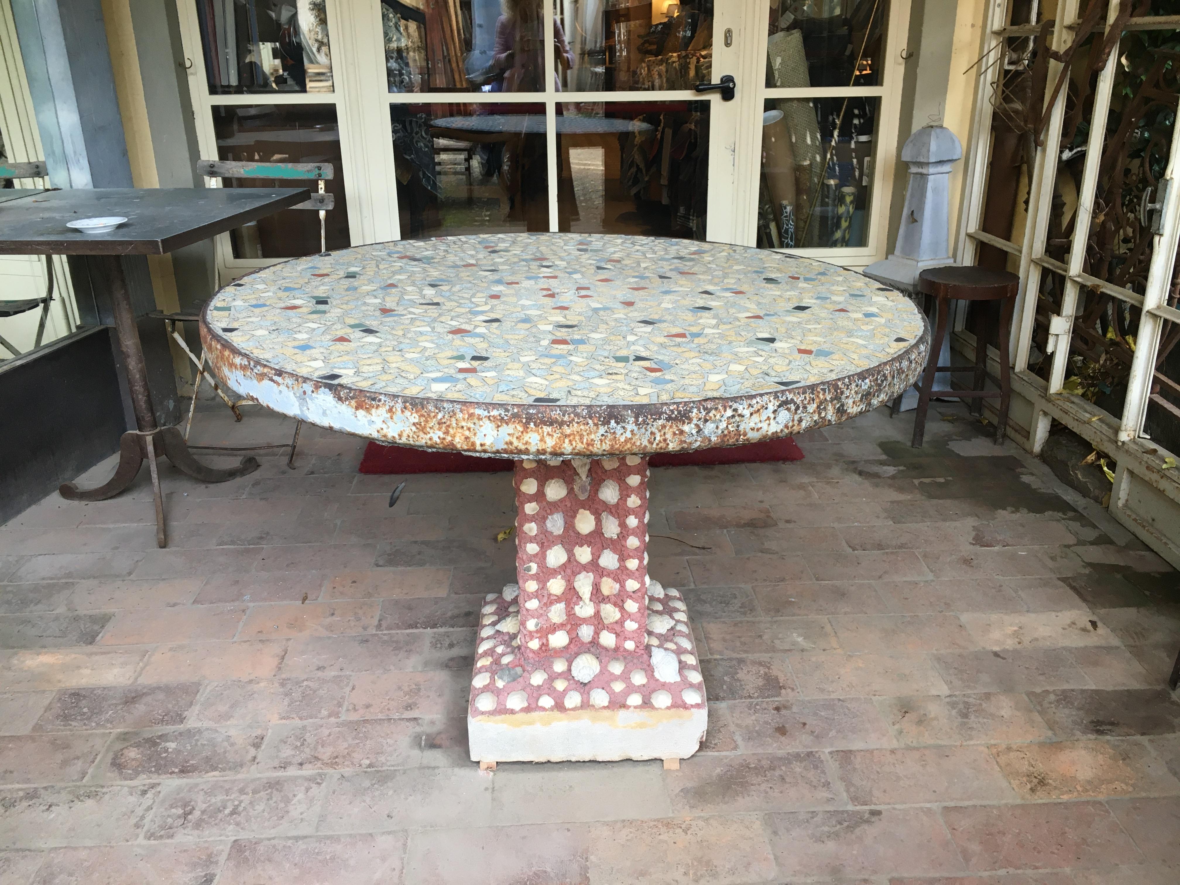 Mid-Century Modern Italian garden table with mosaic and shells, 1960s
This wonderful garden round table has cement mosaic top and cement pedestal with true shells insert.