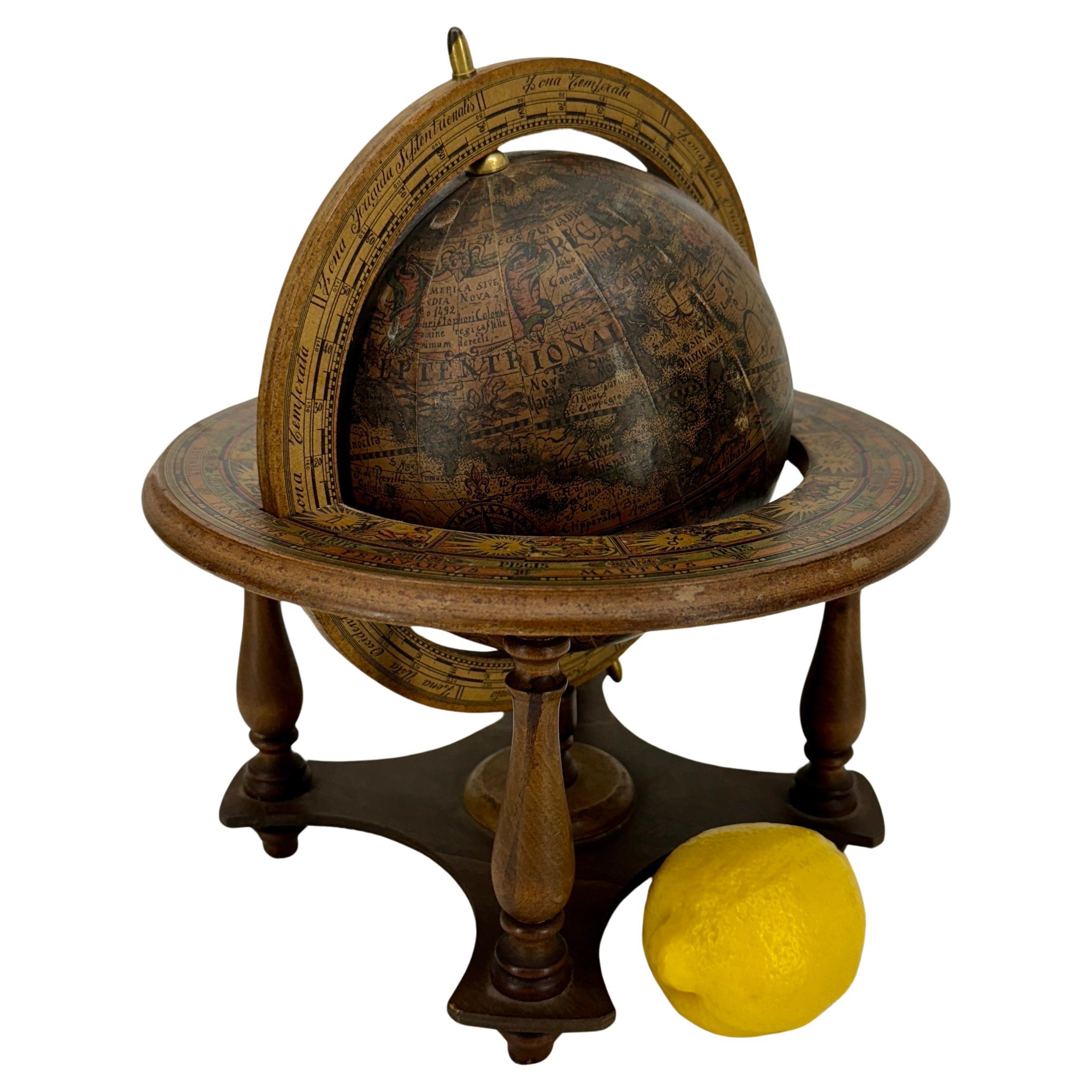 Mid-Size Tabletop Vintage Wooden Spinning Globe, Italy

Charming hand-crafted Mid-Century Modern spinning tabletop globe featuring an antique design sepia brown world map. The globe is beautifully crafted with exquisite detailing including zodiac