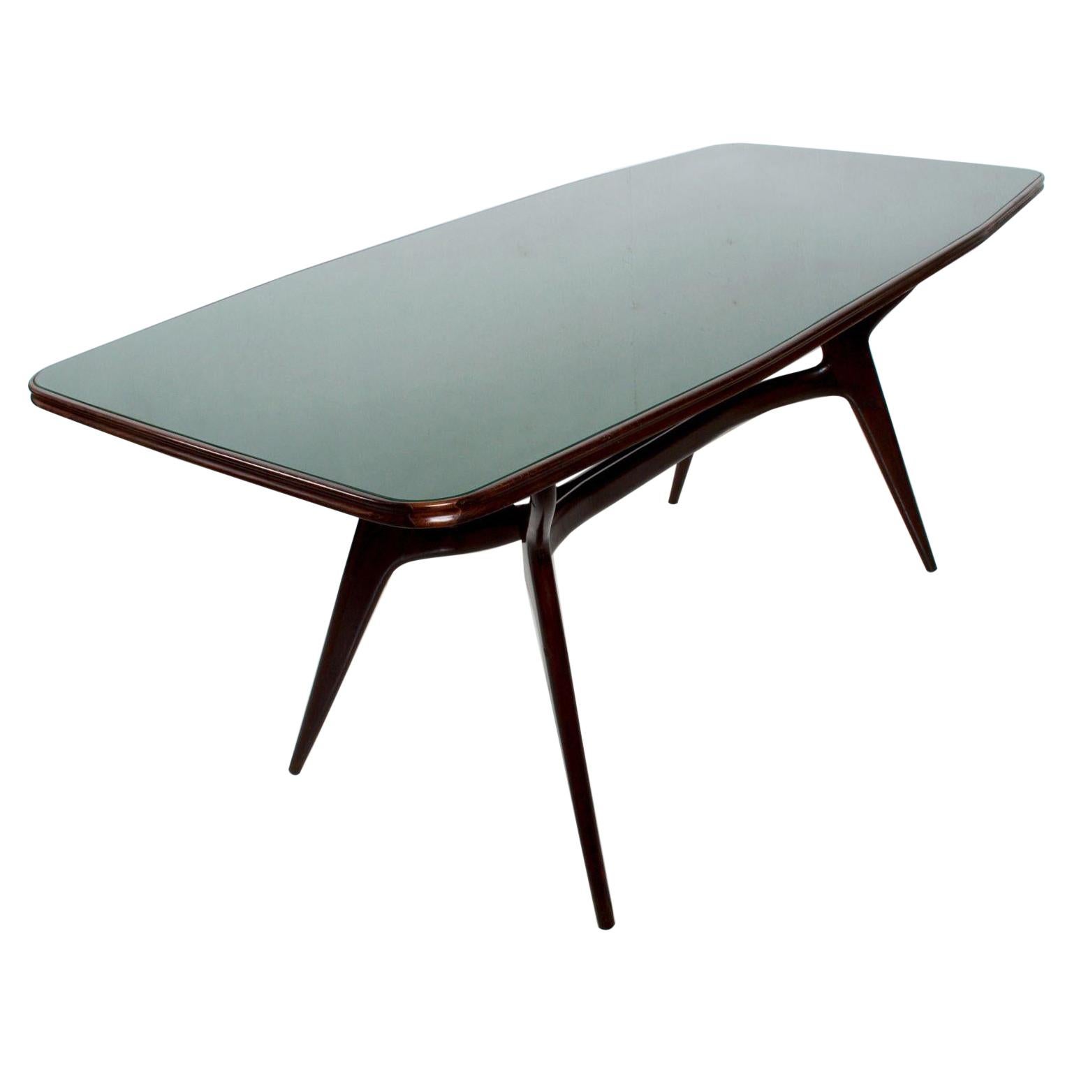 Mesa de comedor verde italiana moderna de mediados de siglo según ICO PARISI años 50. 
La mesa tiene una bonita forma escultural. Acabado en caoba. 
Le ofrecemos 6 sillas de comedor a juego con nuestra mesa de comedor ICO PARISI.
Vea nuestros