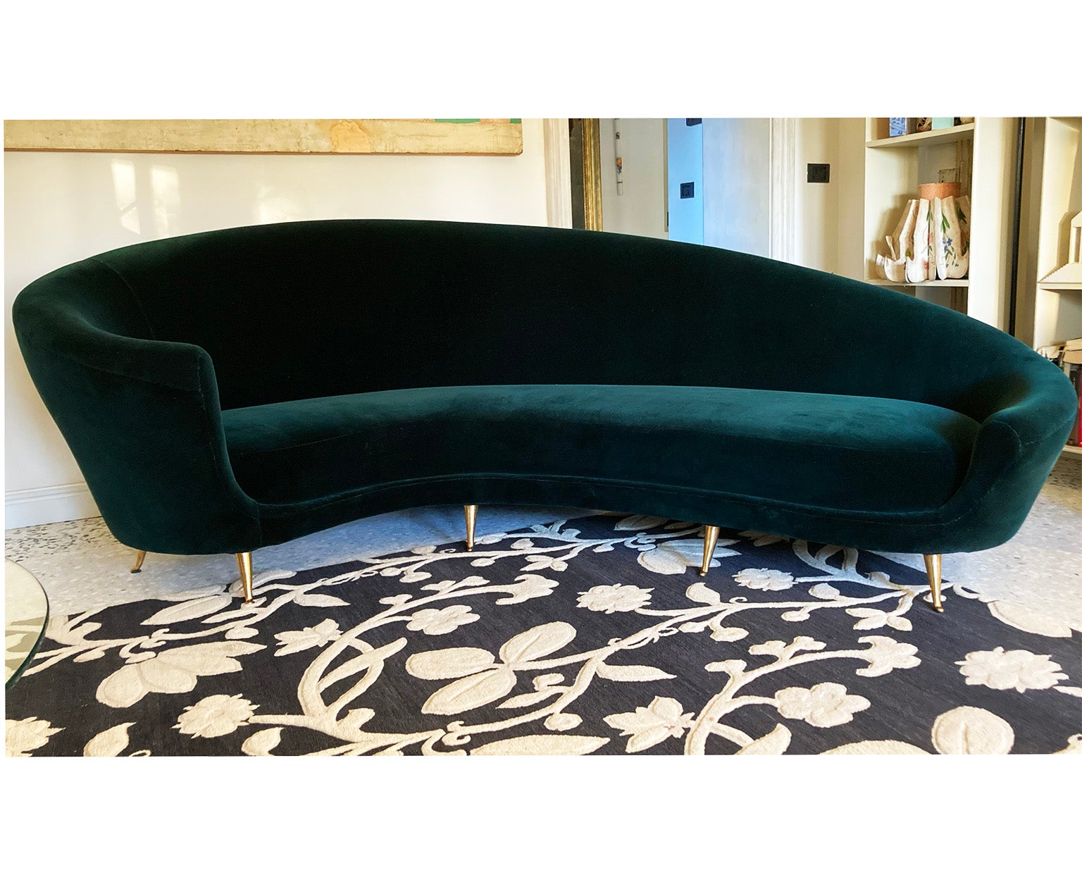 Mid-Century Modern Italian green velvet curved sofa by I.S.A, Italy 1950s.
Fine Design with well proportioned curved shape, with brass feet that gives another touch of elegance. 
The green velvet is pure cotton italian velvet.

The listed PRICE 