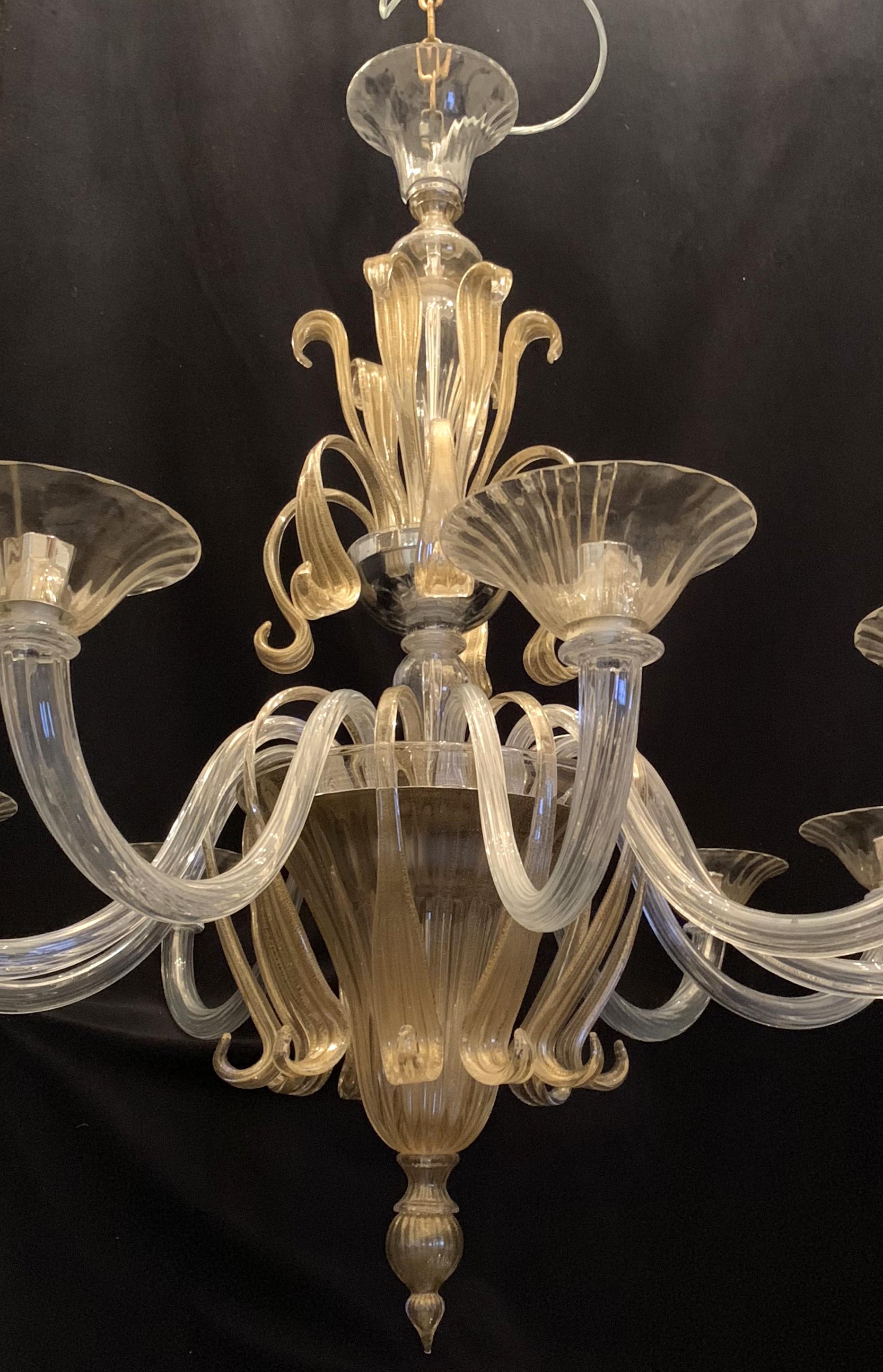A wonderful Mid-Century Modern Italian leaf form clear and gold Murano art glass large multi level 10-light chandelier measures approximate 43
