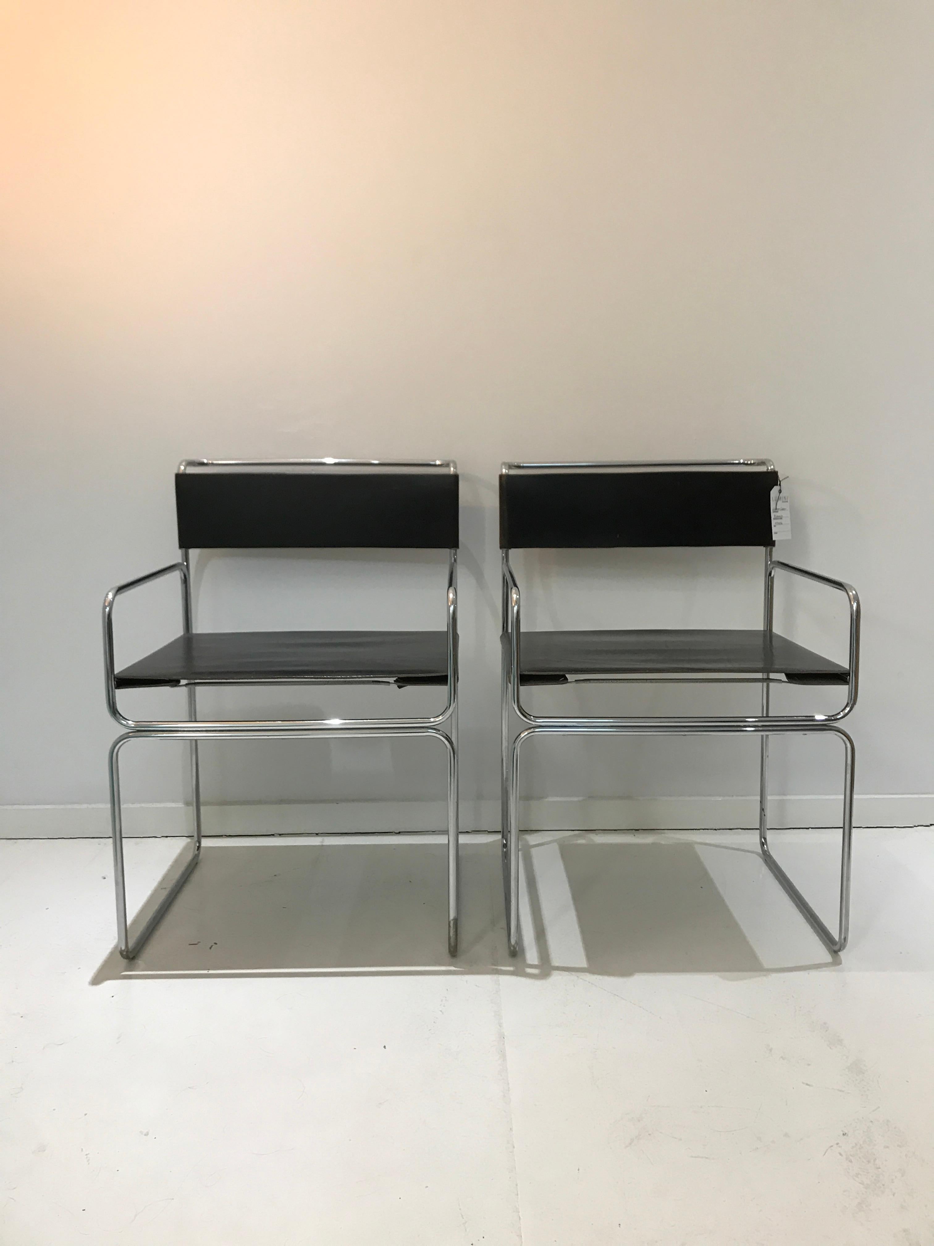 Two vintage Planula design chairs by G. Carini 1970 four leather dining chairs by designer Giovanni Carini and made by Planula Design Italy. These chairs have a chrome-plated tubular steel frame with thick leather and not often seen with armrests!