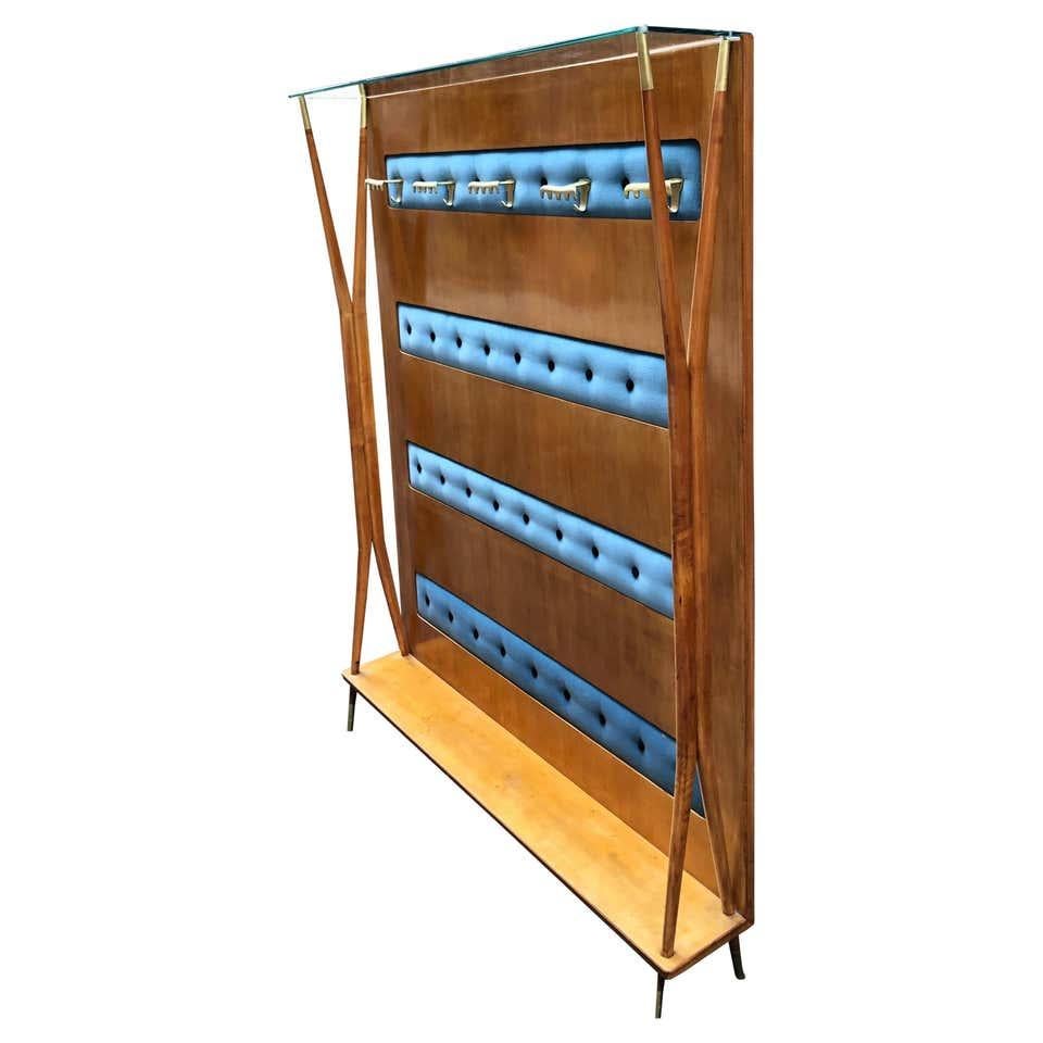 Coat rack form Italy form 1950s period. Light Beech tree wood structure with hangers and feet rings made of brass. A glass shelf on the top and a wood one on the bottom are useful to store and display something for example hats or shoes. Size: W 142