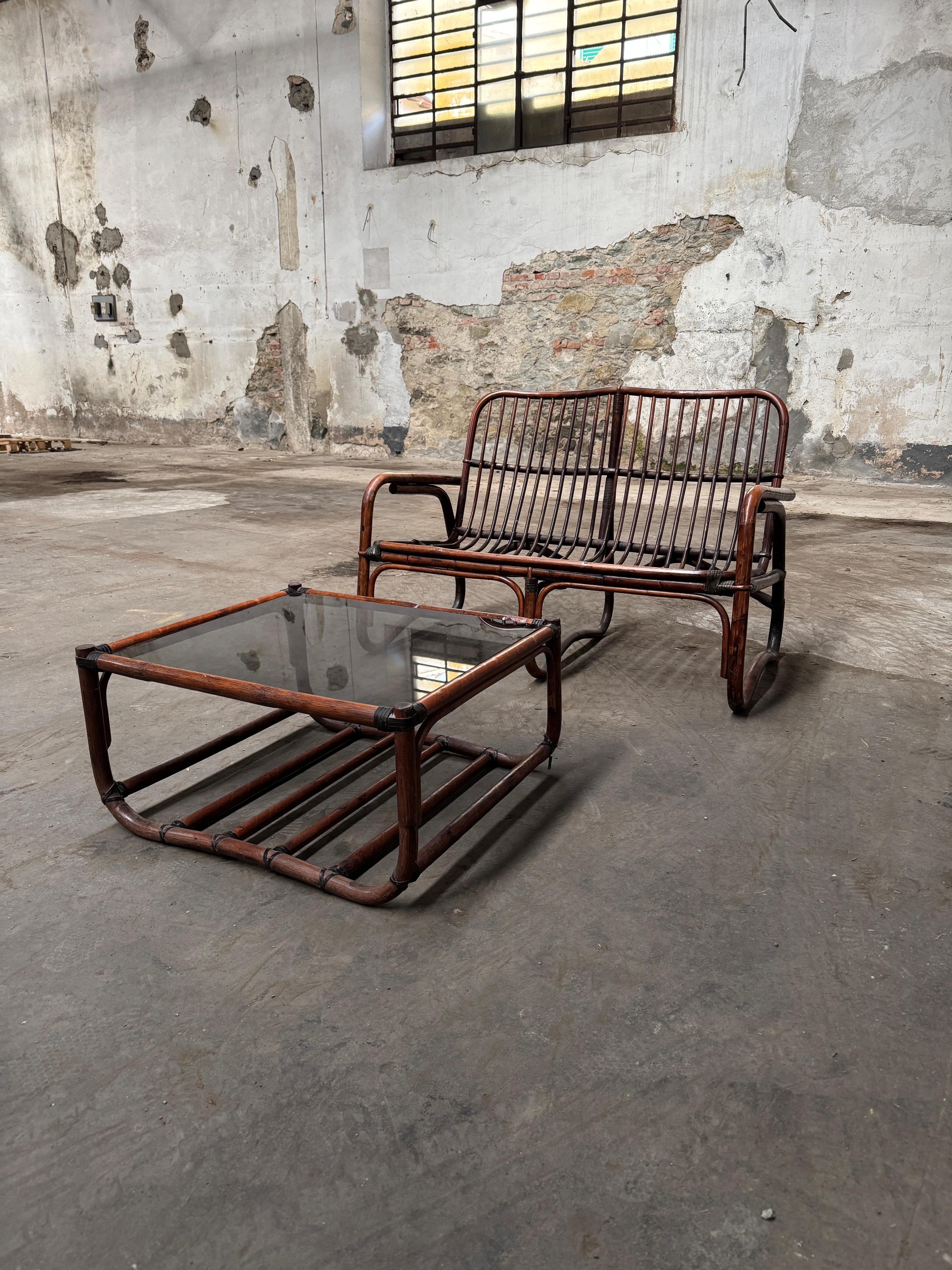 Mid-Century Modern Italian Living Room Bamboo Set consisting in 1 sofa and 1 glass top coffee table in very good vintage conditions.
A couple of slats of the seat are damaged, but they can be easily replaced and do not affect the comfort of the seat
