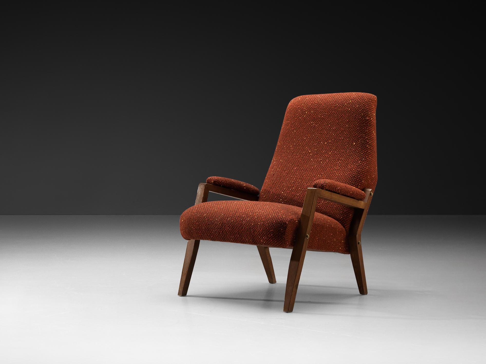 Armchair, beech, fabric, Italy, 1960s.

The chair's shape is a perfect example of mid-century modern design, showcasing clean lines, angular elements, and an overall sense of elegance and simplicity. The backrest is tall and gently reclined,
