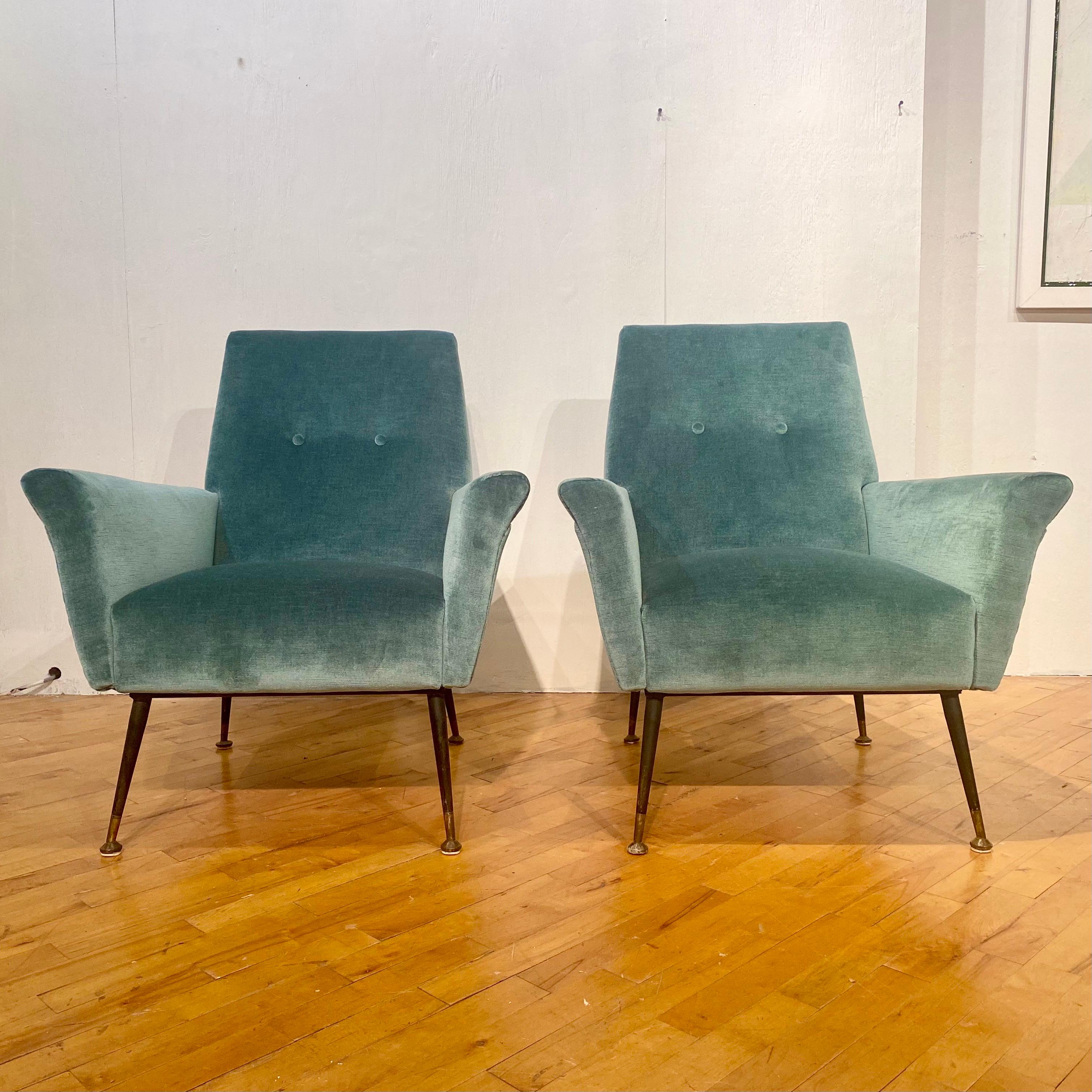Outstanding vintage pair of Italian lounge chairs, fully restored. Velvet upholstery with brass tipped feet. Recently restored and imported from Italy.