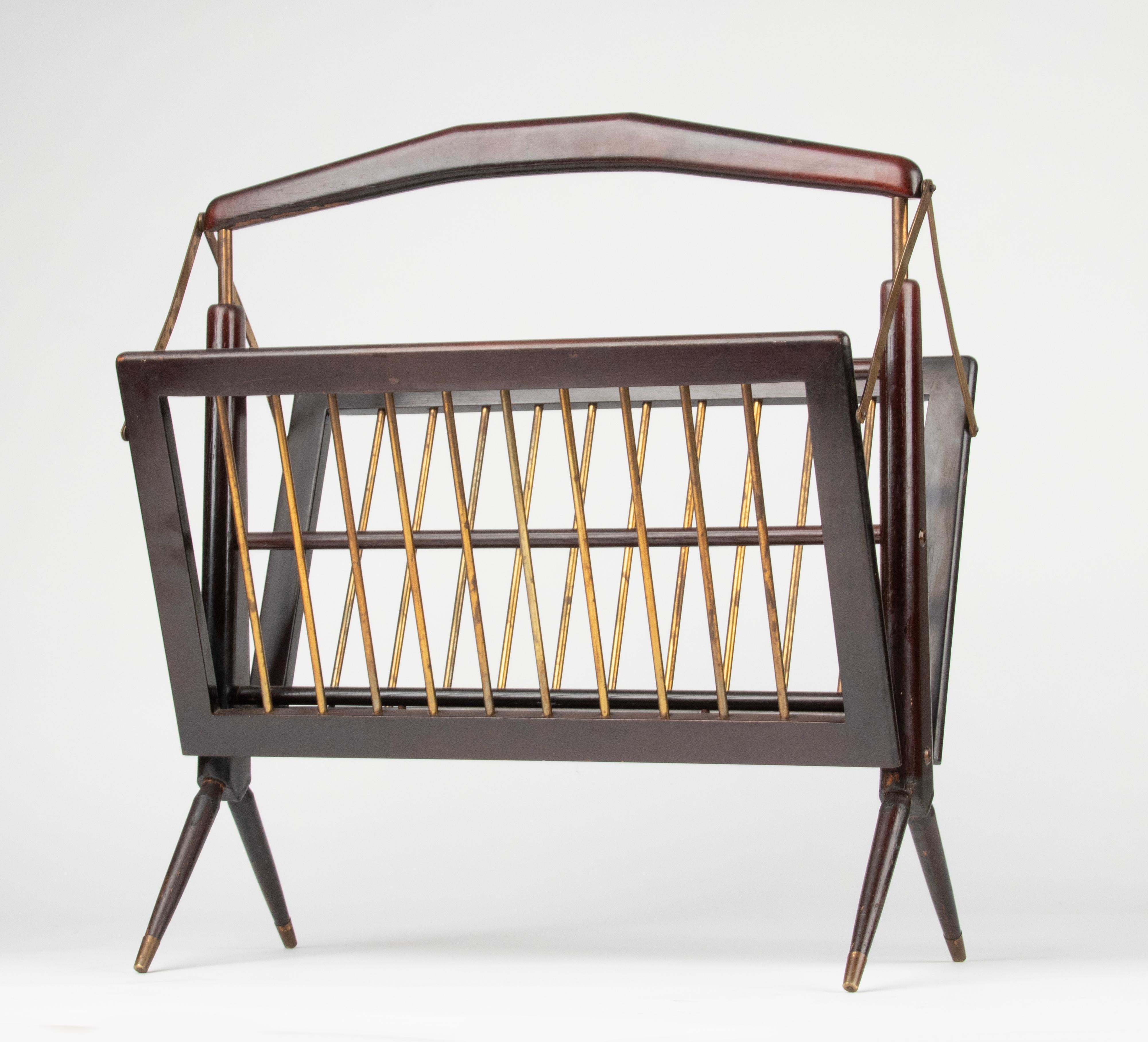 Wonderful magazine rack by Cesare Lacca. It is made of deep red lacquered beech wood with copper colour metal rods. Produced in Milan, Italy, during 1950s. It is both elegant and functional, as wood and copper colour are perfectly mixed and it can