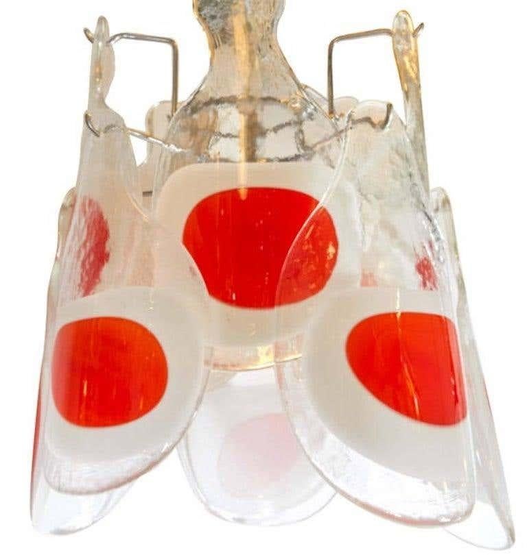 Italian Mid-Century Modern Mazzega glass chandelier with clear, white and orange / red blown disk elements.
 Fixture only (without chain) 16