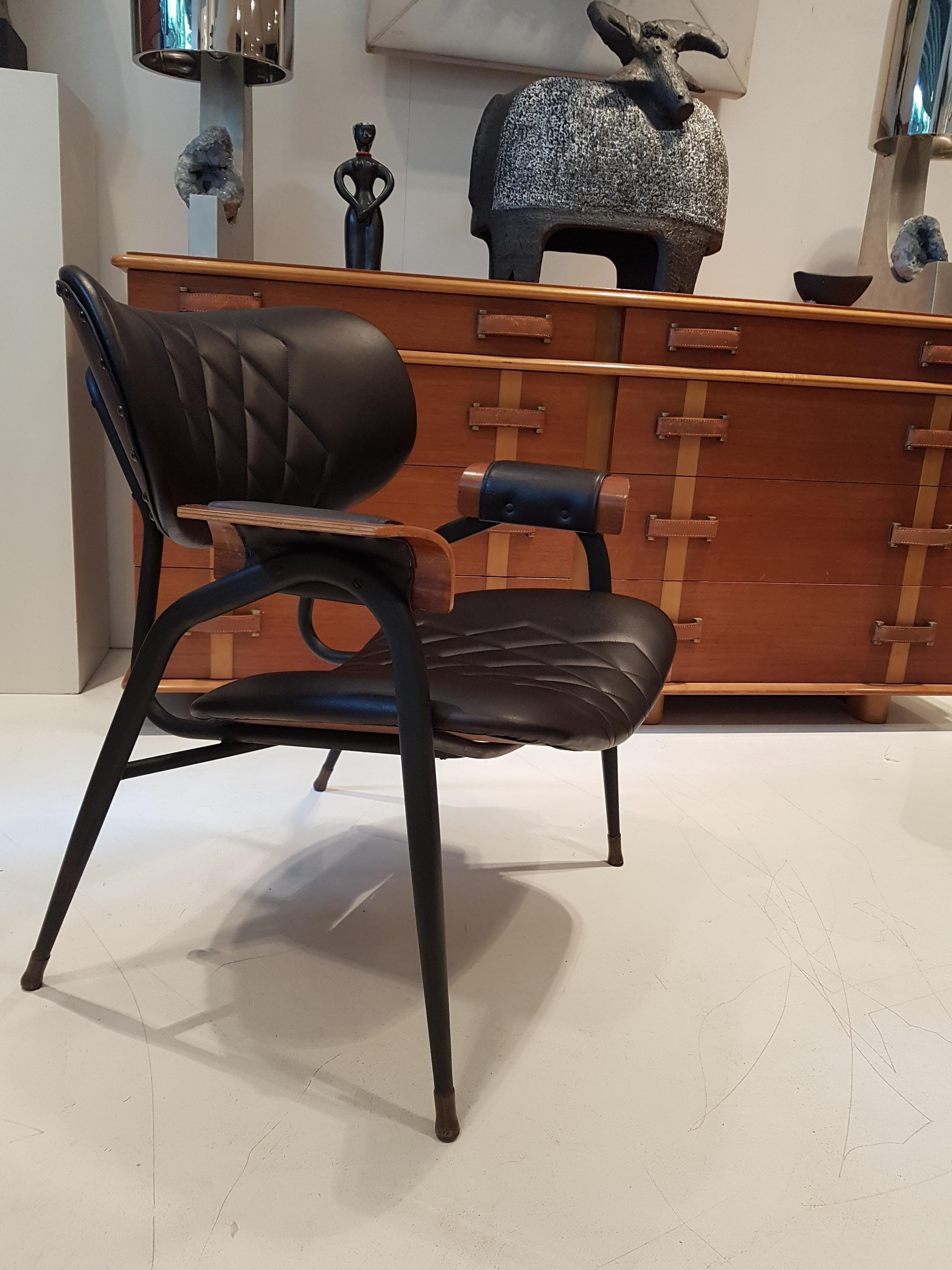 Pair of black lacquered metal framed armchairs with polished wooden arm rests reupholstered in black leather by Rima.