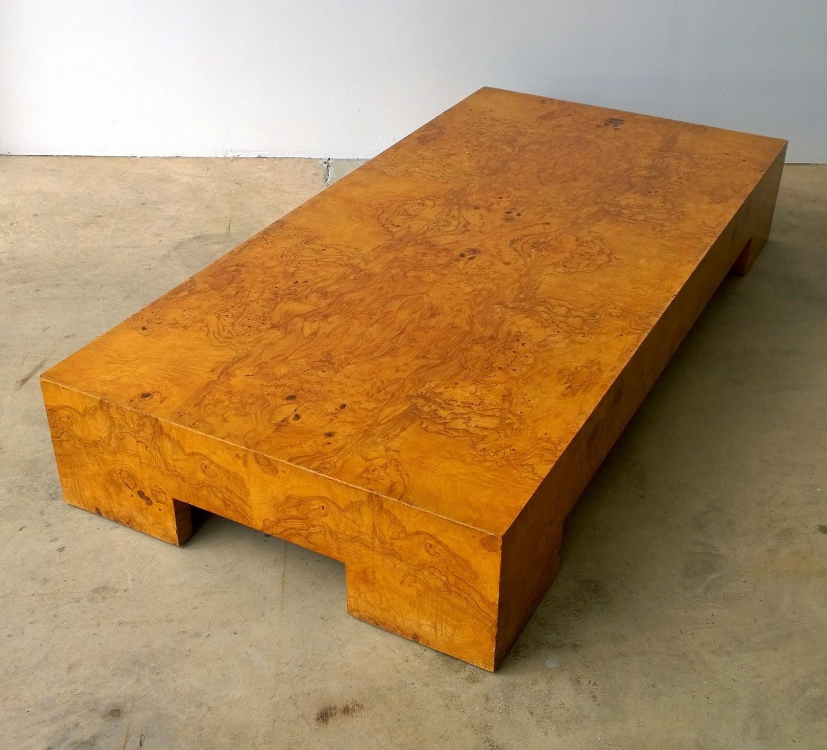 Offered is a Mid-Century Modern Italian Milo Baughman style burl wood veneer coffee / cocktail / low table. This piece is Minimalist in its lines yet quite elegant with the use of the burl wood. This low table was usually produced as a large square