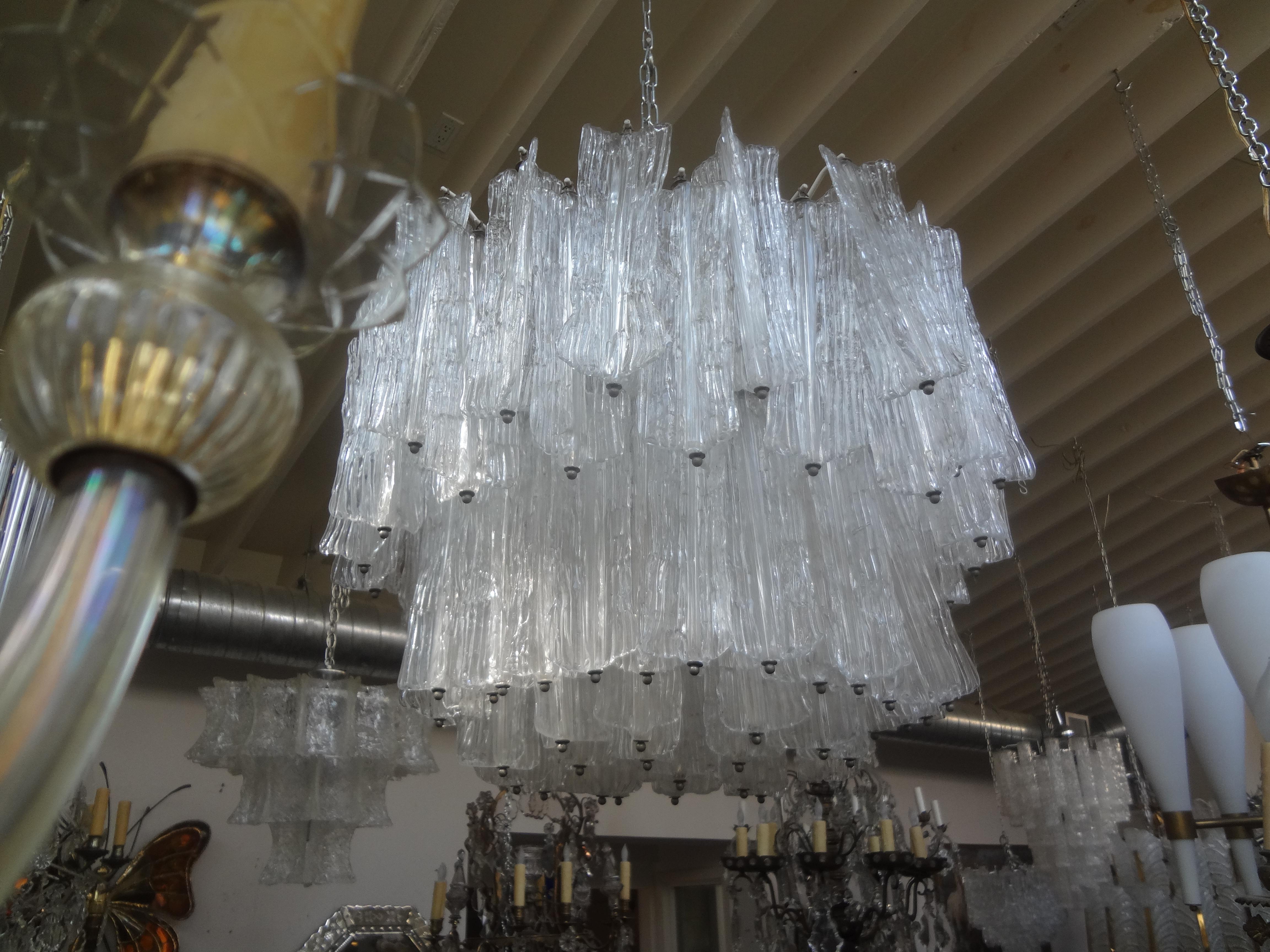 Mid-Century Modern Italian Murano glass chandelier attributed to Venini.
Our stunning Murano midcentury Murano chandelier is attributed to Toni Zuccheri for Venini.
This large Murano glass chandelier with unusually shaped blocks has been newly wired