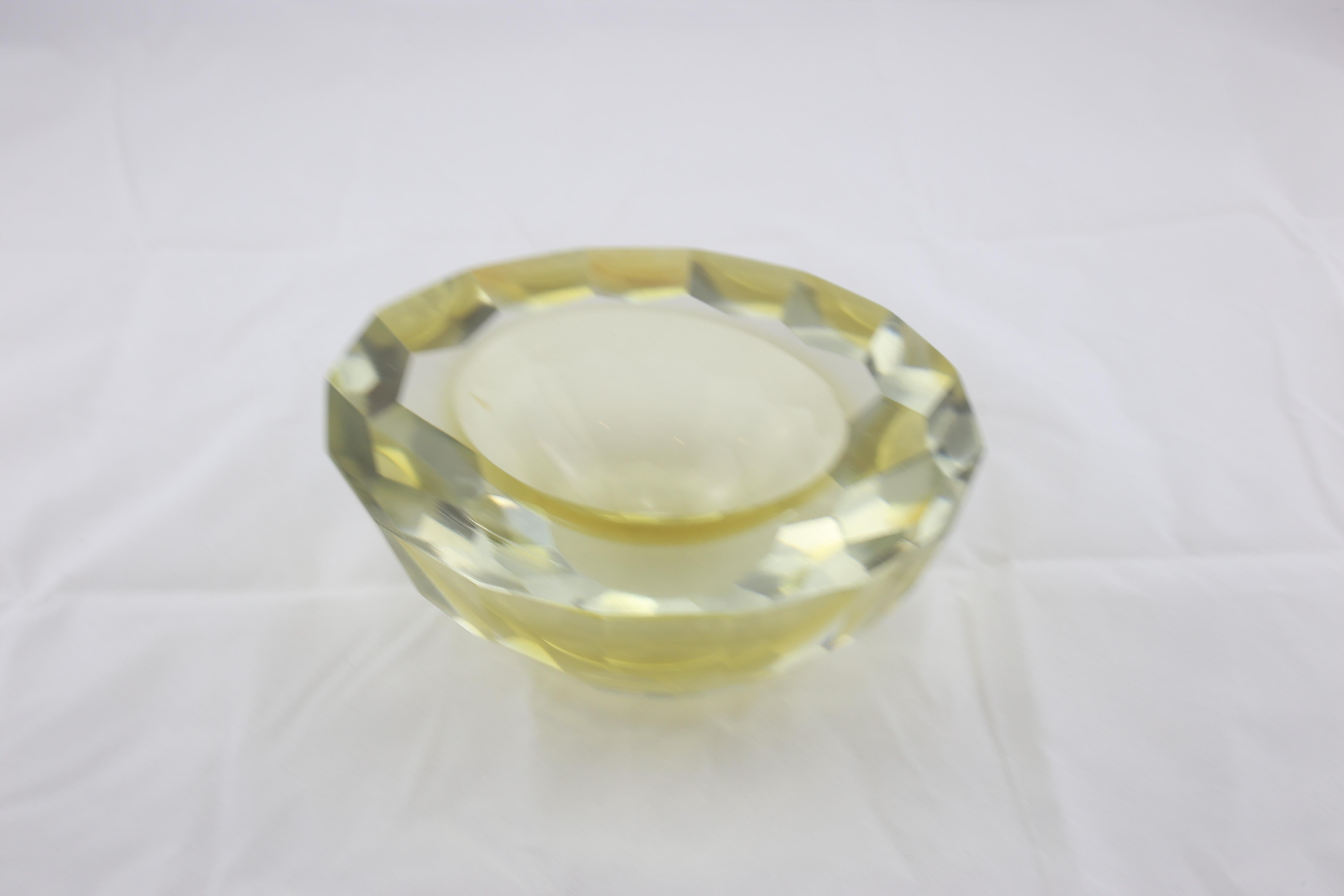 Beautiful Italian Murano ashtray the glass has yellow reflections and is heavy tick glass.
Perfect condition.
 