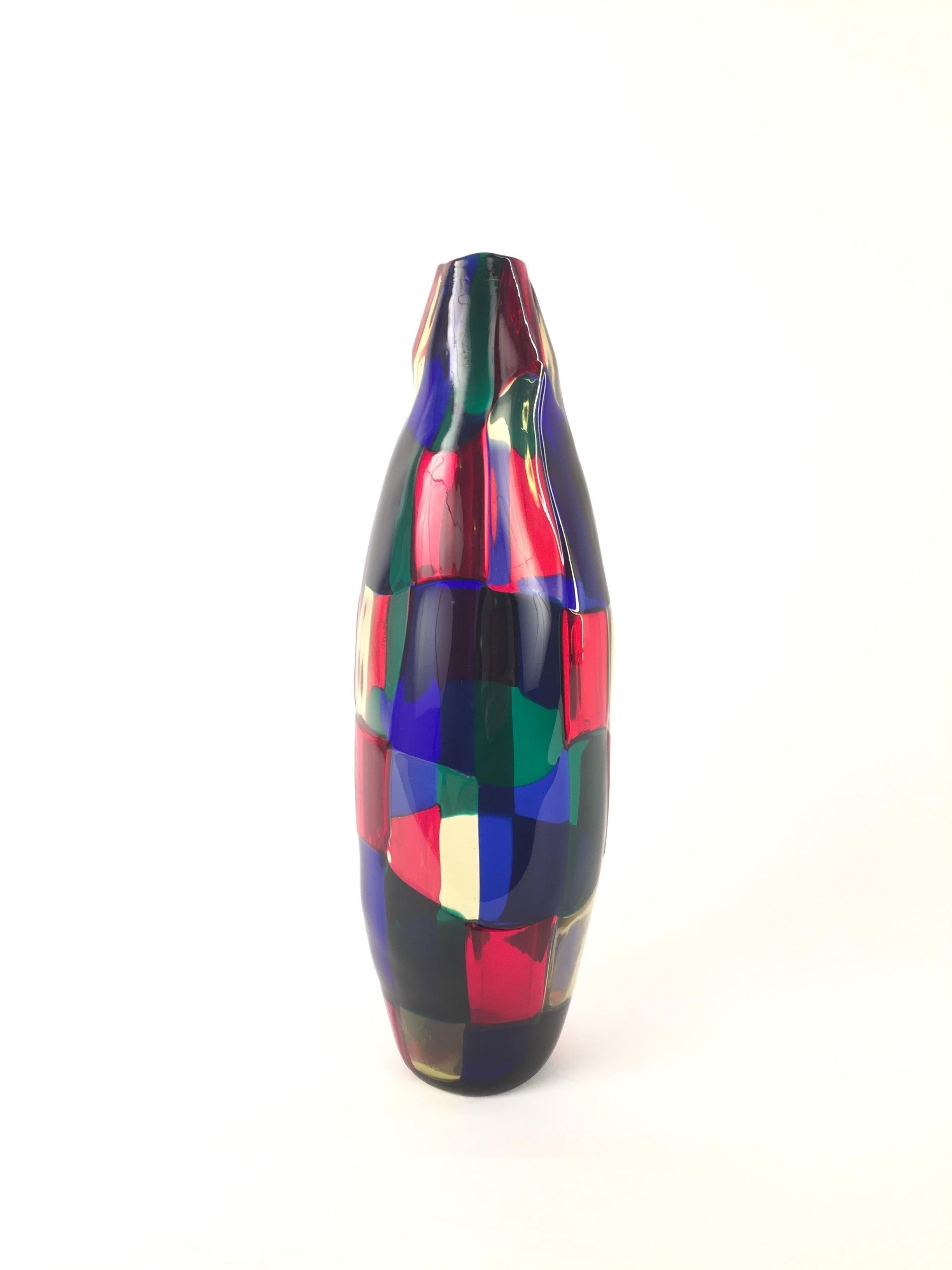 A Mid-Century Italian glass vase. Designed by Fulvio Bianconi for Venini. Pezzato Model. Blue, red and green patchwork. Signed and dated on the botton. Height 29 cm. Excellent condition.