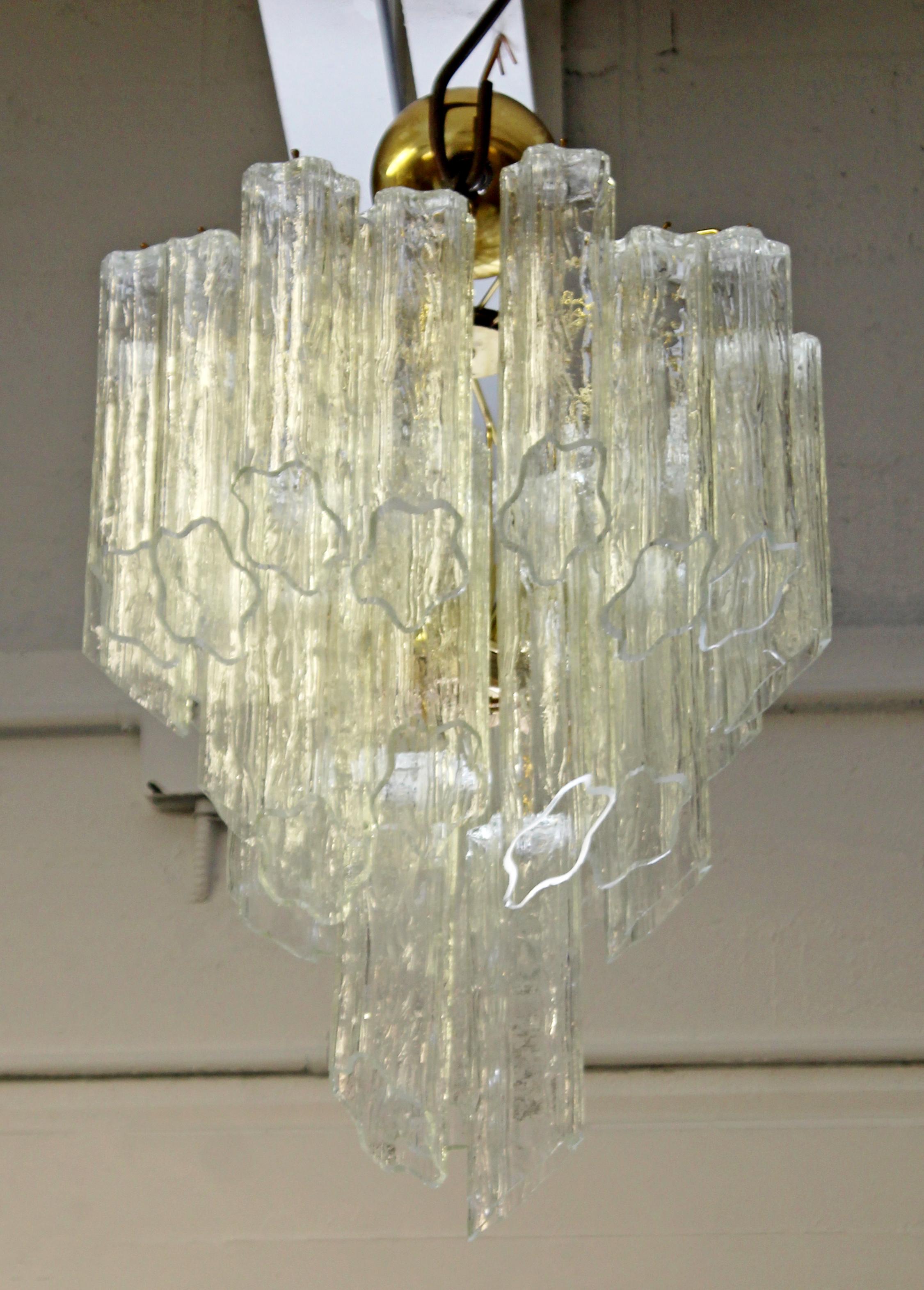 For your consideration is a phenomenal, tiered Murano slant cut glass and brass chandelier, made in Italy, circa 1970s. In excellent condition. The dimensions are 16