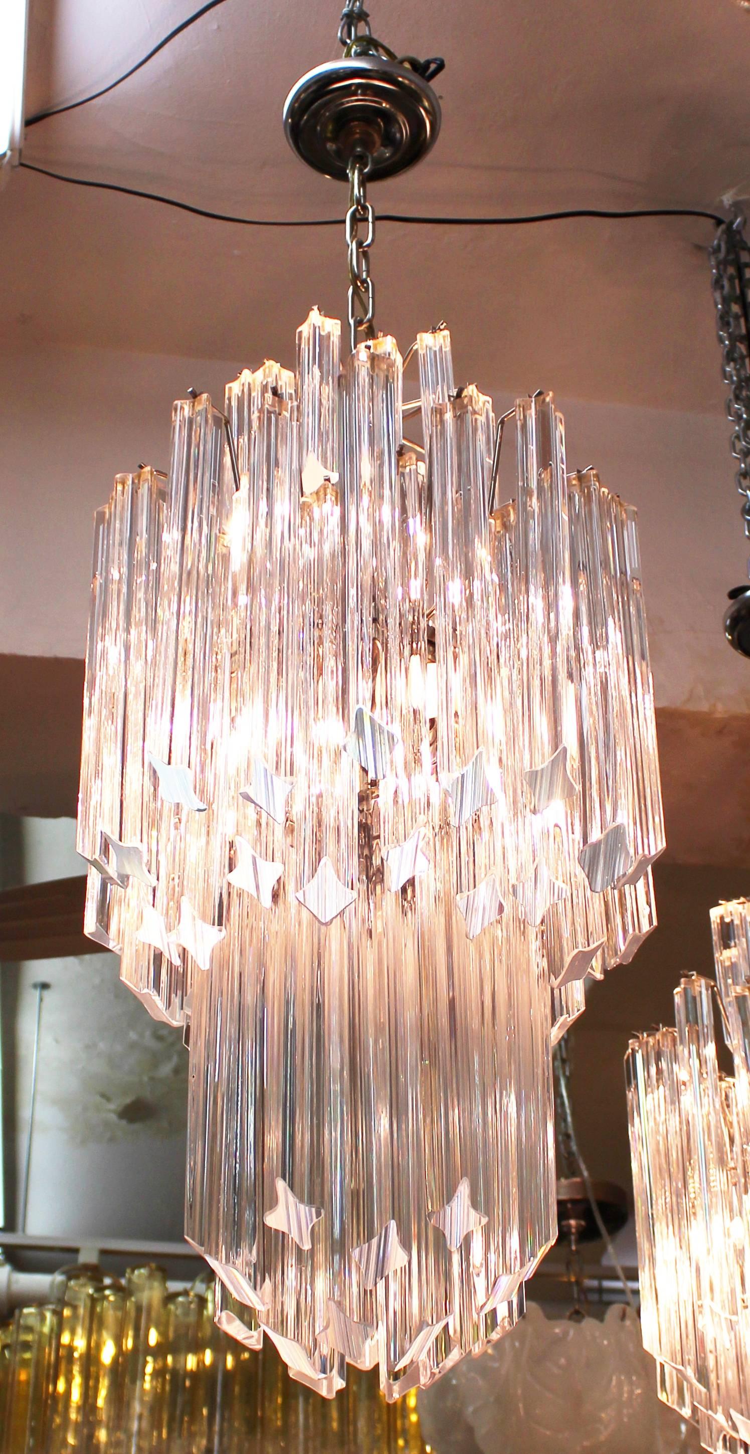 Mid-Century Modern Italian Murano glass chandelier with Venini prisms. Only one is available. It has been rewired and is in great condition, with minor chips on a few of the prisms.