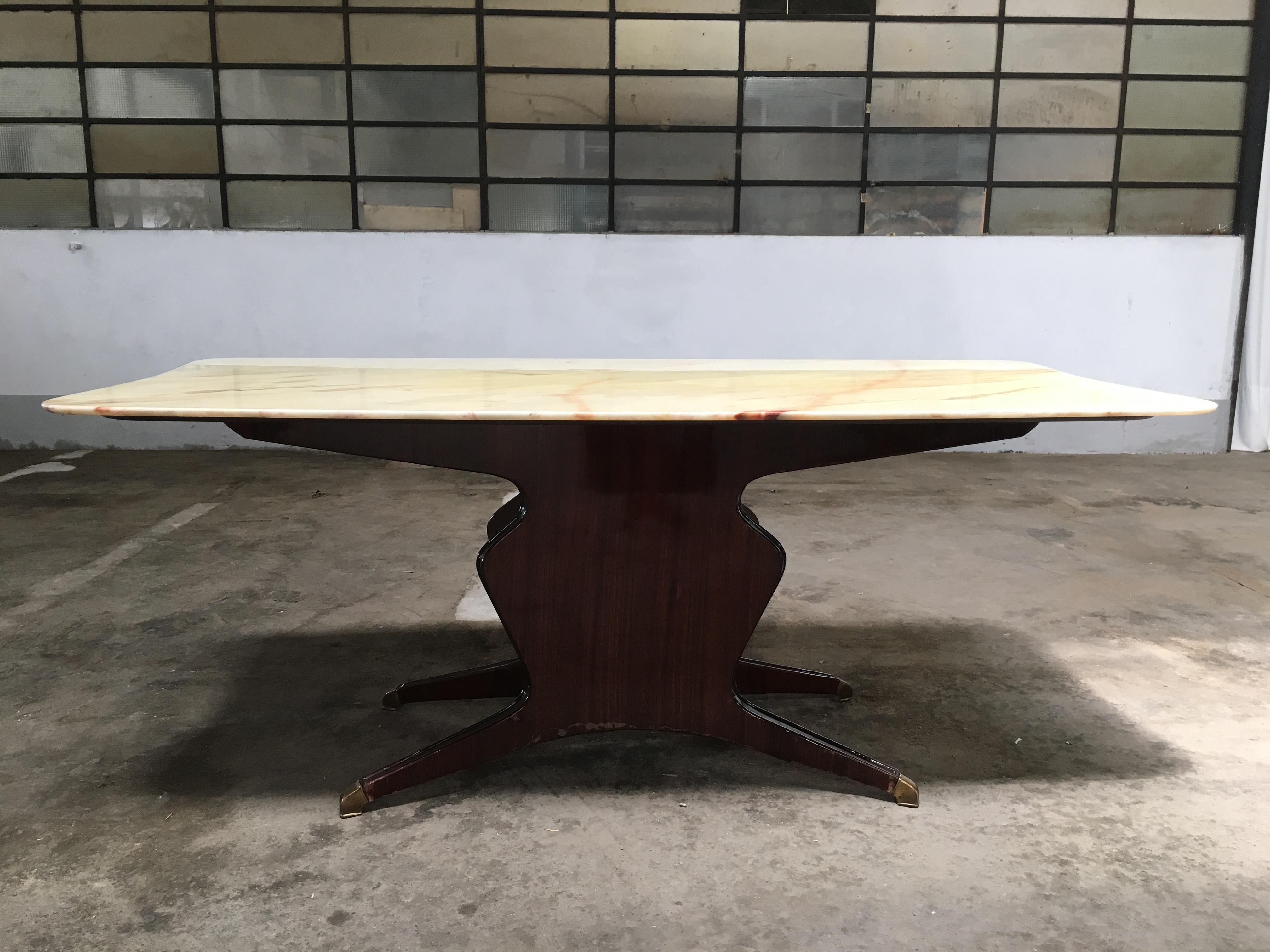 Mid-Century Modern Italian dining or conference mahogany veneer wood and onyx top table with brass feet by Osvaldo Borsani produced by 