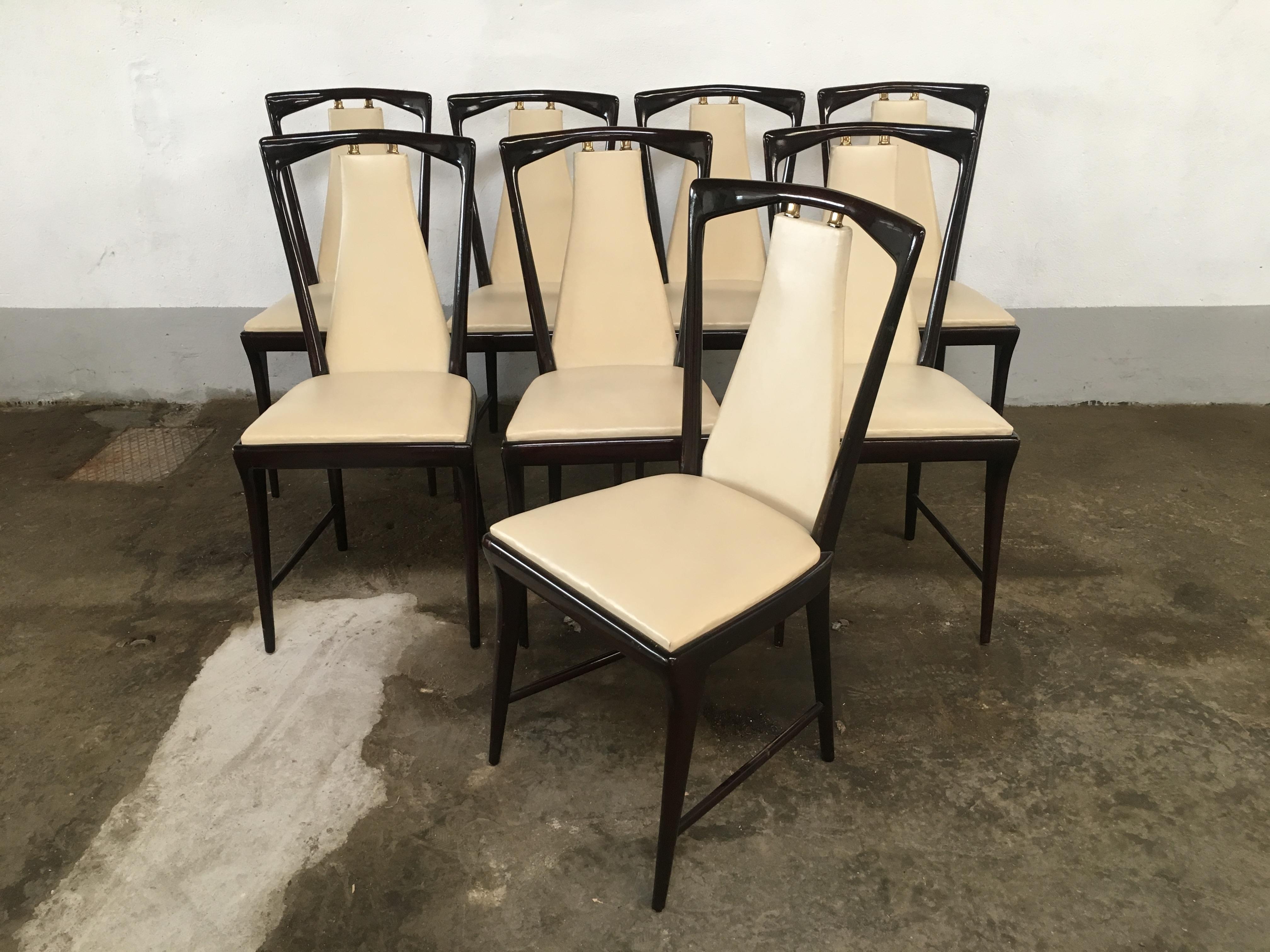 Mid-Century Modern set of 8 Osvaldo Borsani mahogany and faux leather Italian dining chairs with brass details from 1950s
The chairs can become a set together with their Dining Table and are a part of a complete dining room set made by Mobilificio