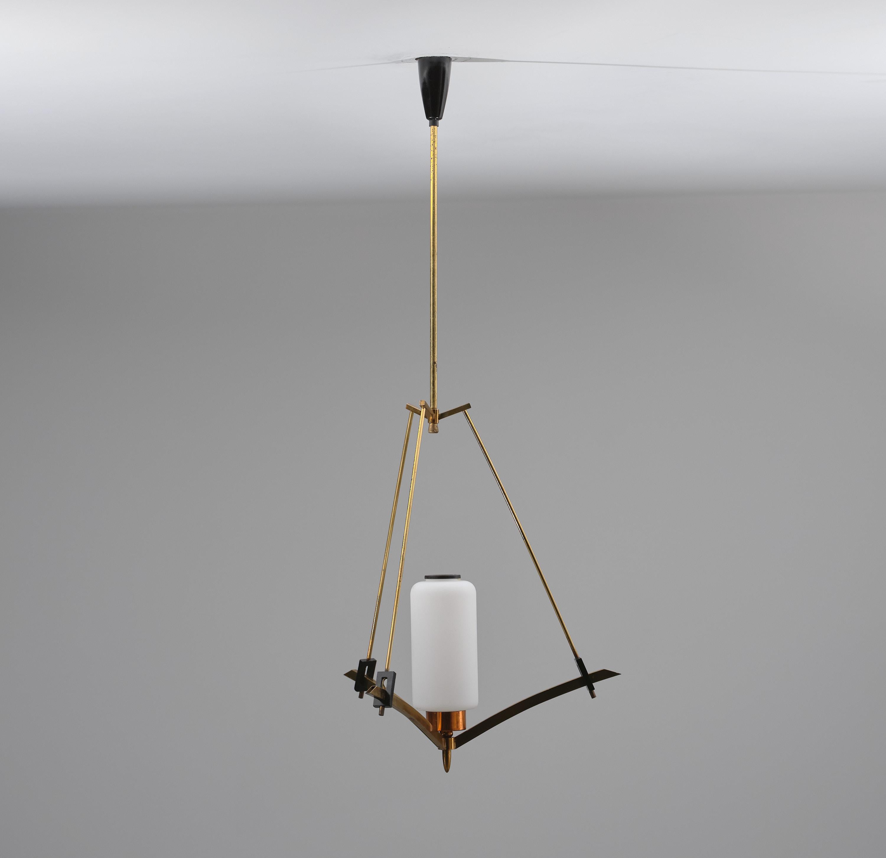 This Italian pendant chandelier exemplifies mid-century modern design, featuring elegant opaline glass and original brass components. It includes verdant lacquered metal accents, offering a nuanced contrast that elevates its aesthetic appeal. The