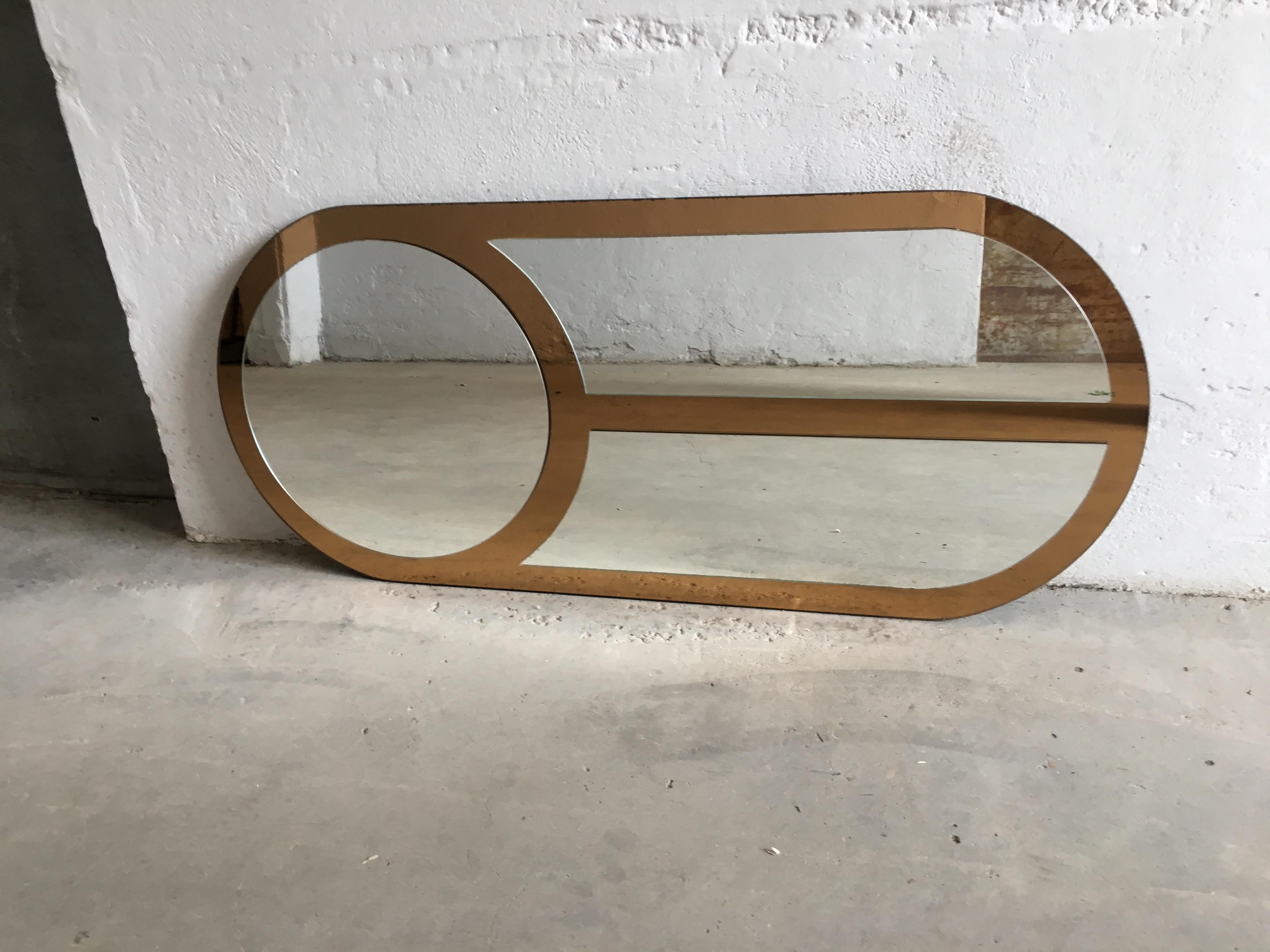 Mid-Century Modern Italian oval shaped wall mirror with gold colored edge, 1970s.