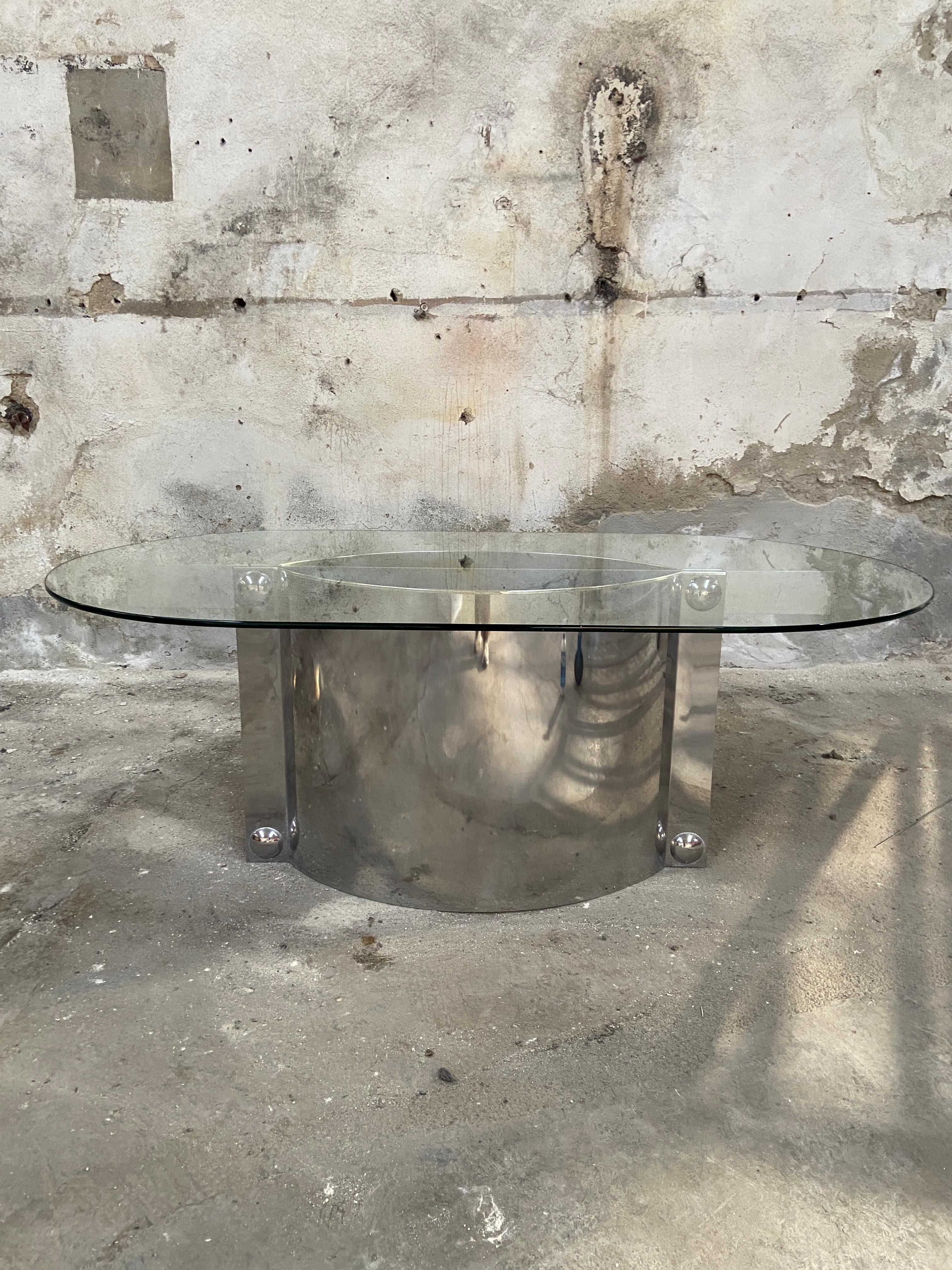 Mid-Century Modern Italian oval shaped glass table with stainless still pedestal by Vittorio Introini.
The table is in really good vintage conditions.