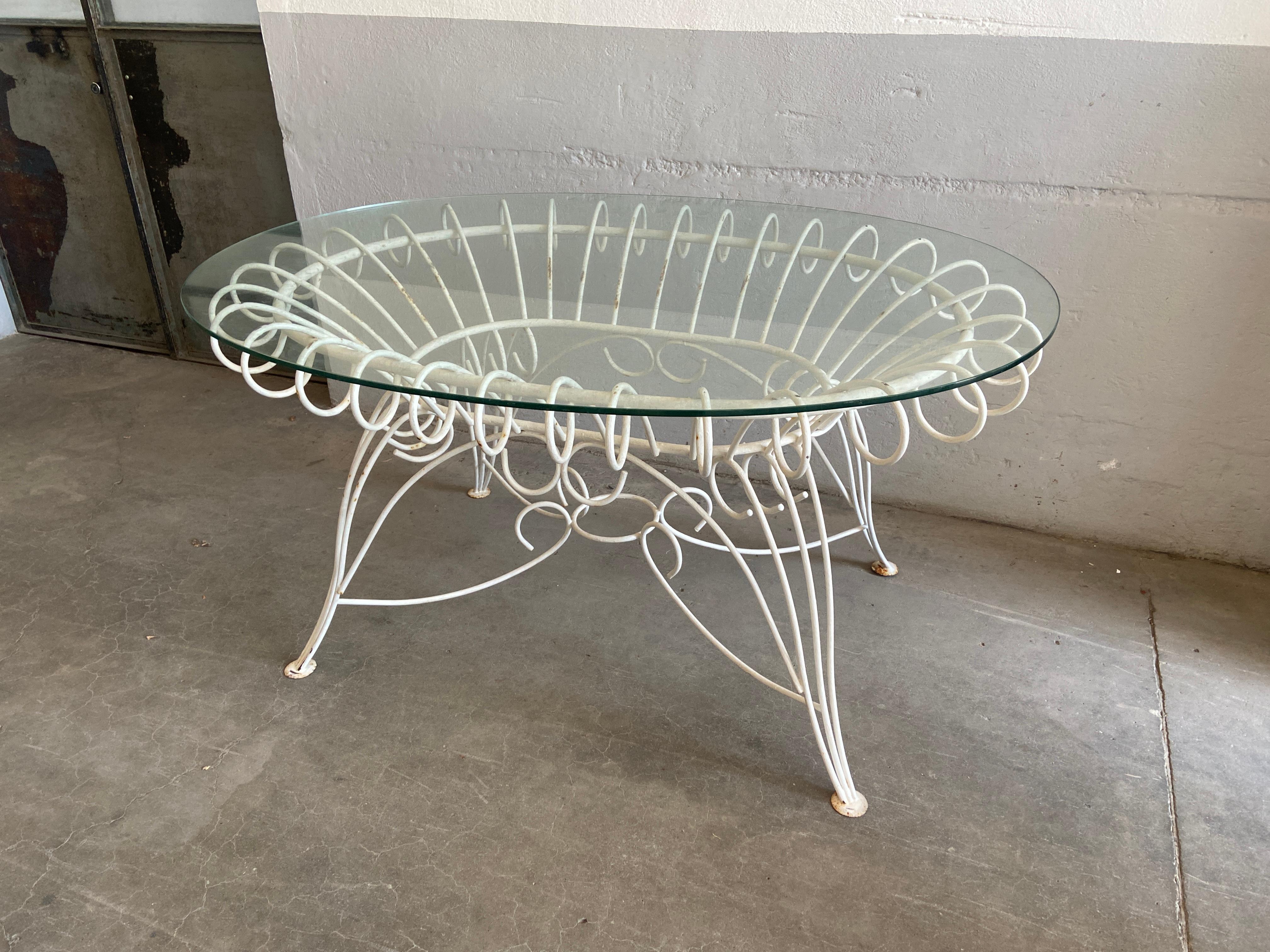 Mid-Century Modern Italian painted iron Garden or Patio table with oval glass top. 1960s.