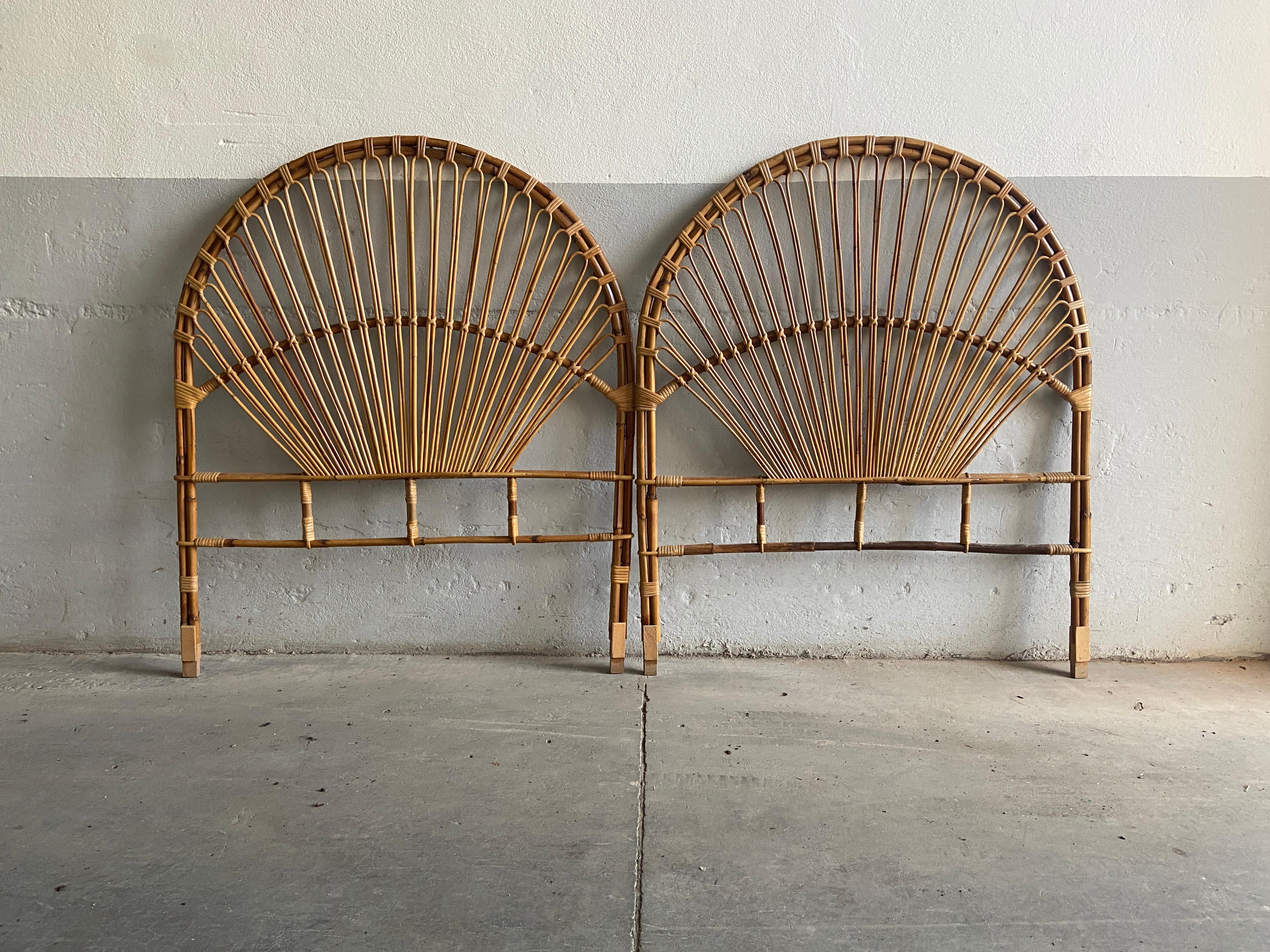 Mid-Century Modern Italian pair of bamboo and rattan peacock headboards.
This headboards can be used for a double bed or for two single beds as well.
They are in very good vintage conditions.
 