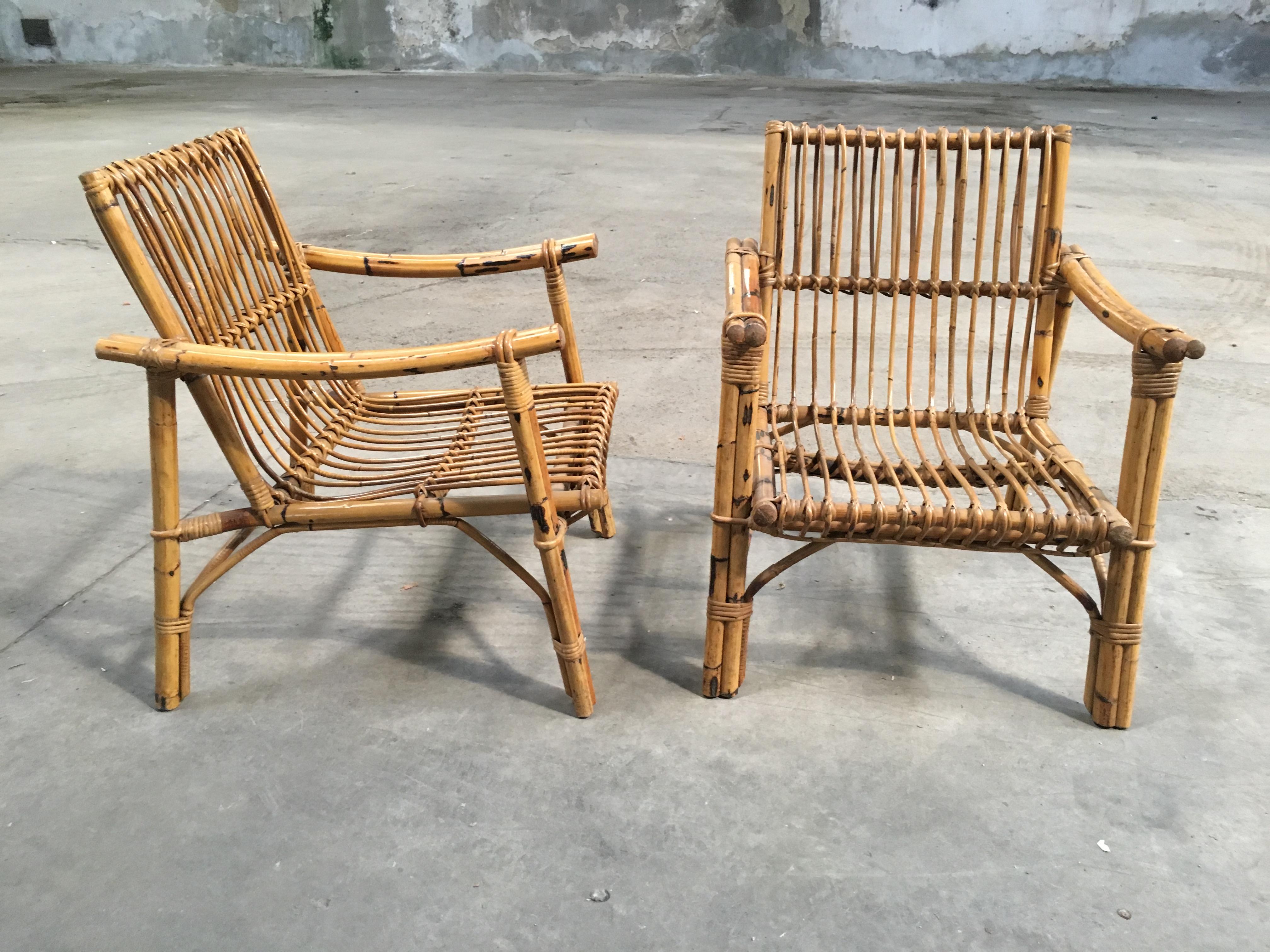 Pair of Italian organic modern bamboo armchairs with original floral cushions from 1960s
The armchairs are n the style of Franco Albini, Paul Frankl, McGuire and they are in really good vintage conditions.