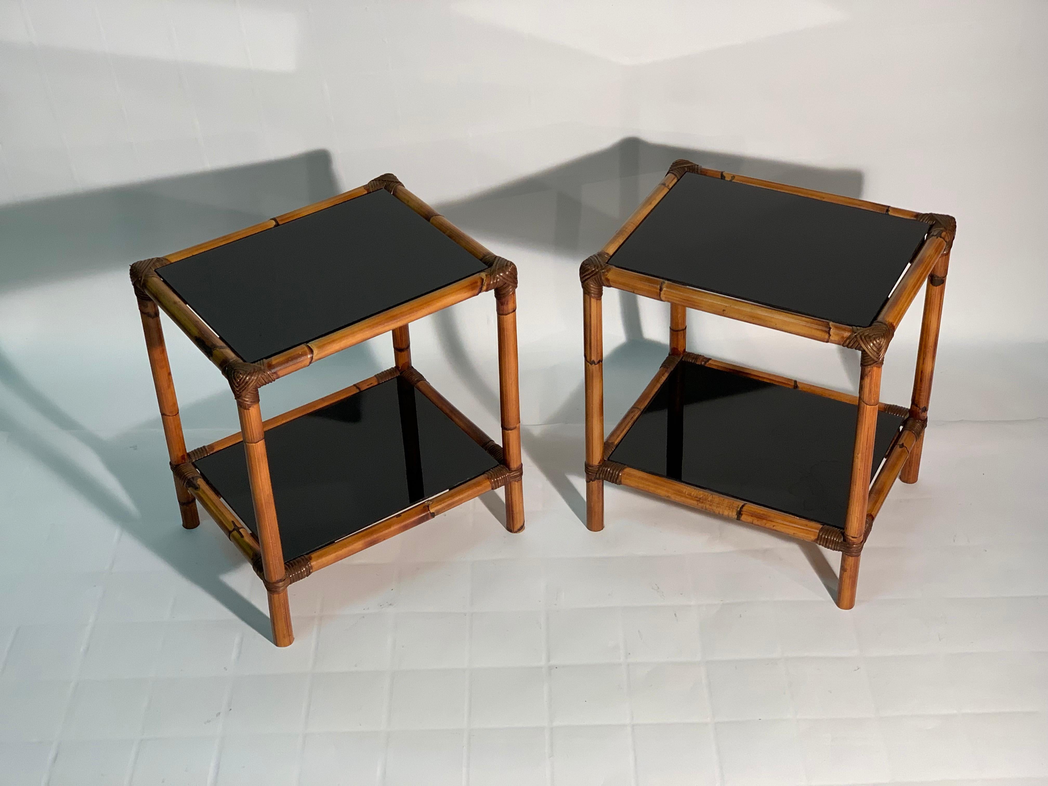Pair of 1960s Italian rectangular tables with double top in black glass. Bamboo structure bound with Rattan.
 