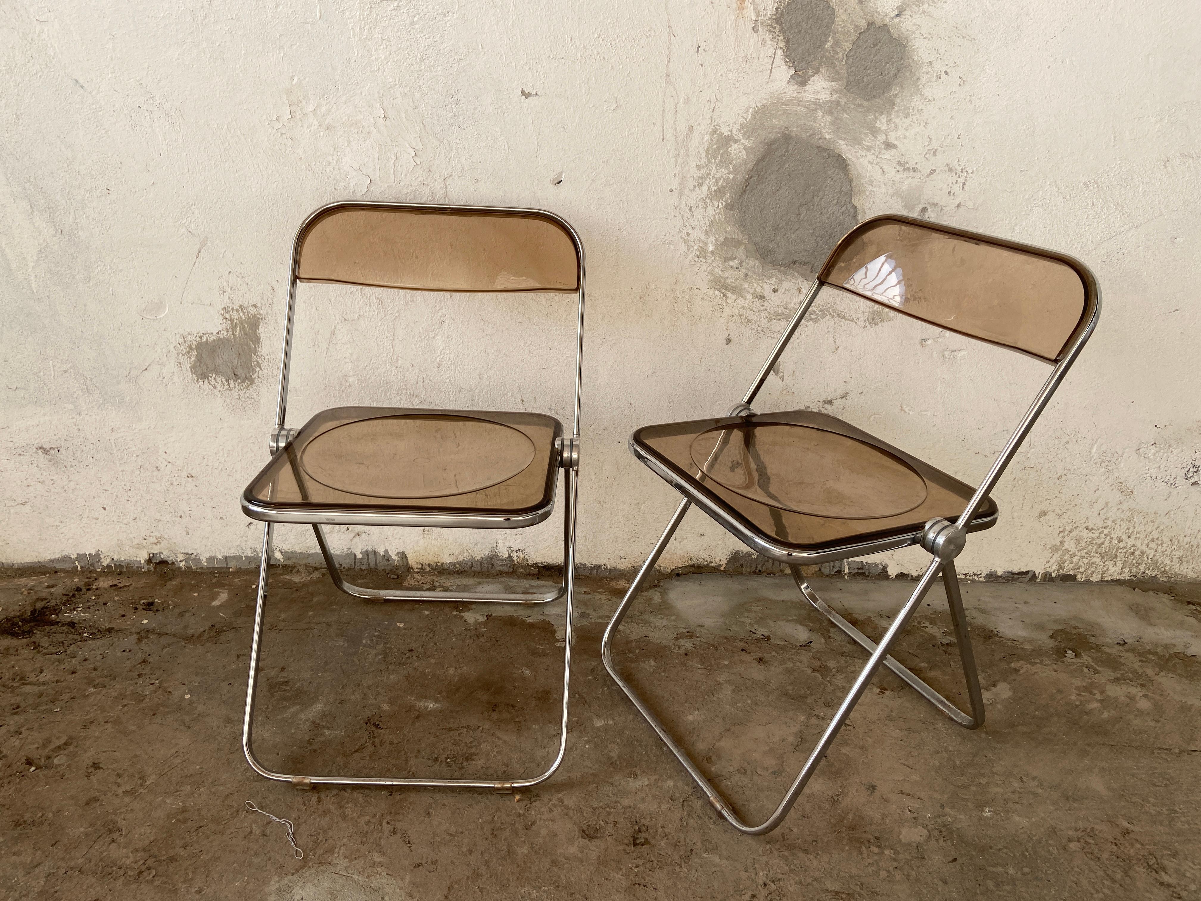 Mid-Century Modern Italian pair of Giancarlo Piretti smoked Lucite 'Plia' folding chairs with chrome structure.