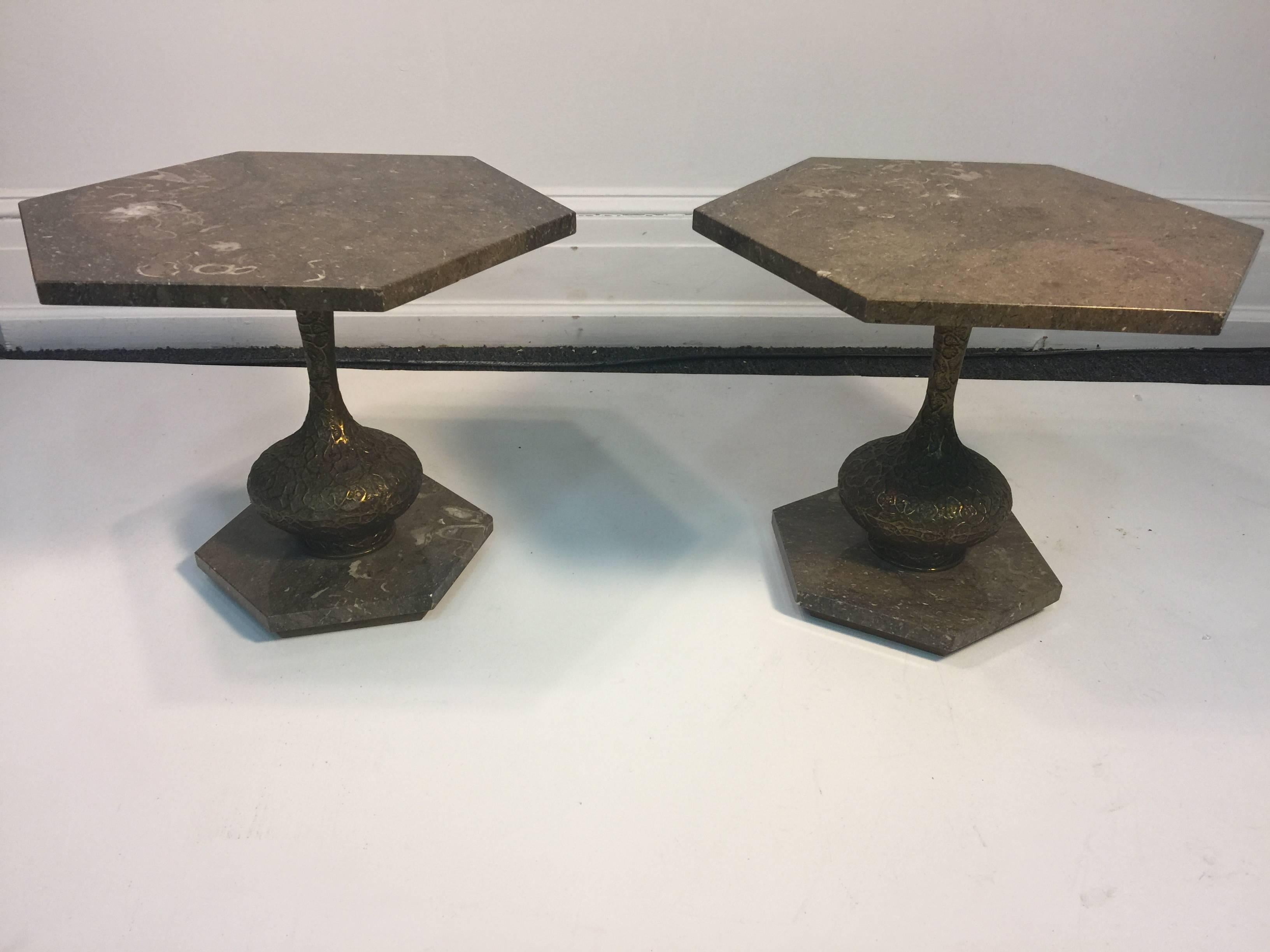 Pair of 1960s Italian tan hexagonal marble top tables with Brutalist gold tone metal bottle shape centre. The bases are smaller hexagonal matching marble bases. The marble top is 3/4