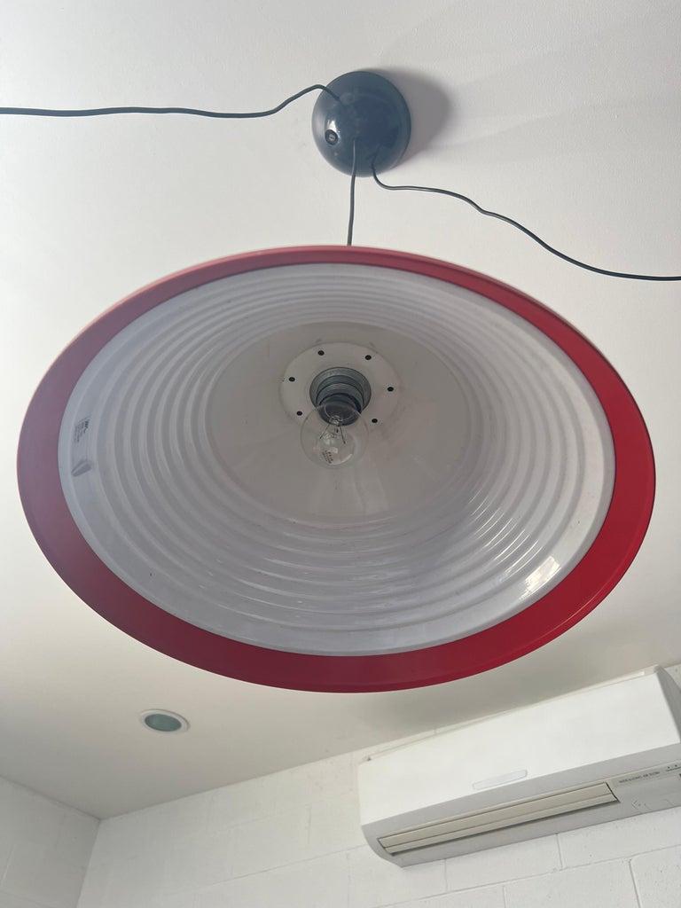 Pair of Mid Century Modern Italian pendant light by Elio Martinelli.
Adjustable height
Elio Martinelli pendant lights are a type of Italian lighting fixtures designed by the Italian designer Elio Martinelli. Martinelli was a prominent designer of