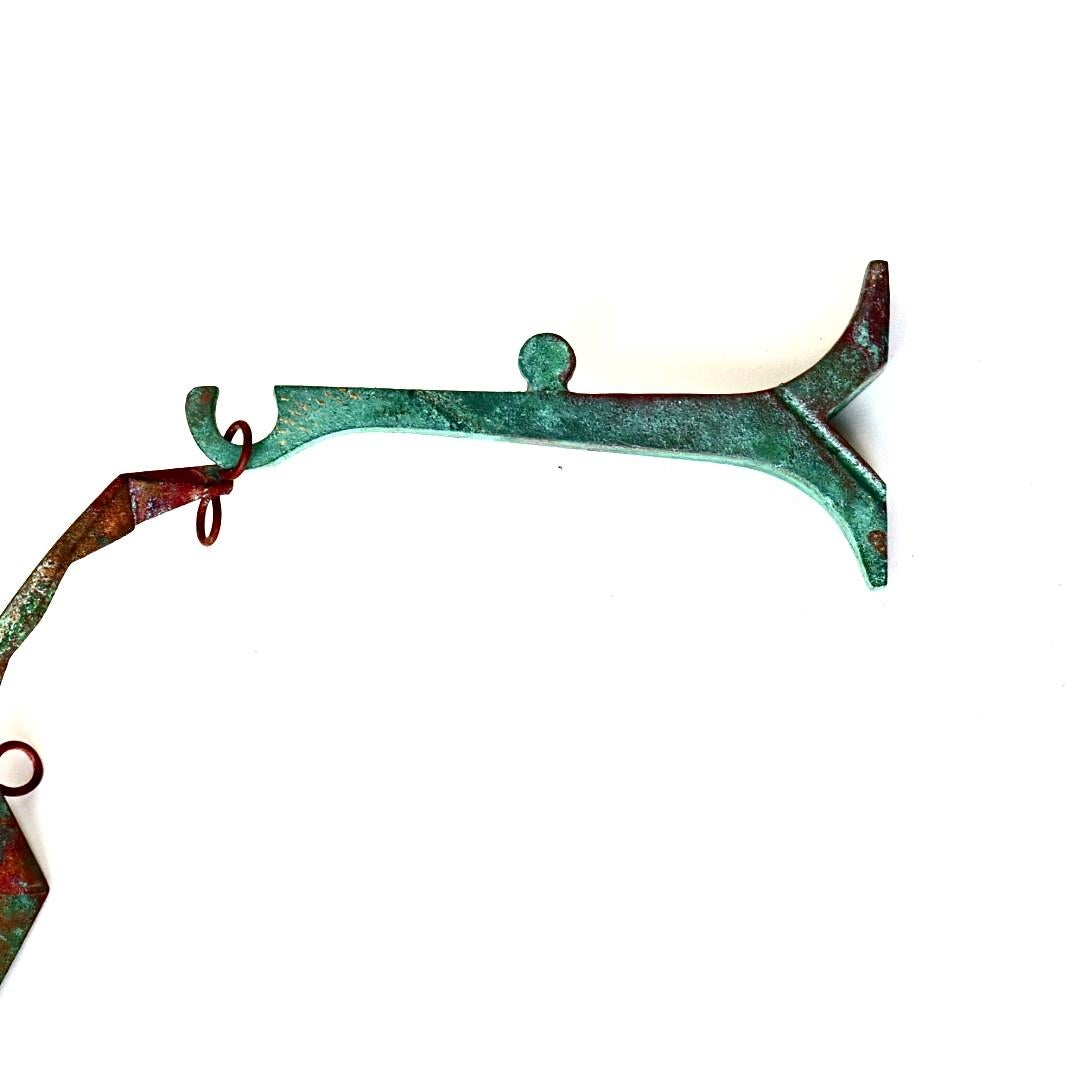 Gorgeous Paolo Soleri bronze wind chime with a striking patina. These iconic and wind chime designed by architect, Italian designer Paolo Soleri for Arconsanti (the city he designed and built in Arizona in 1970).
Bronze cast elements with verdigris